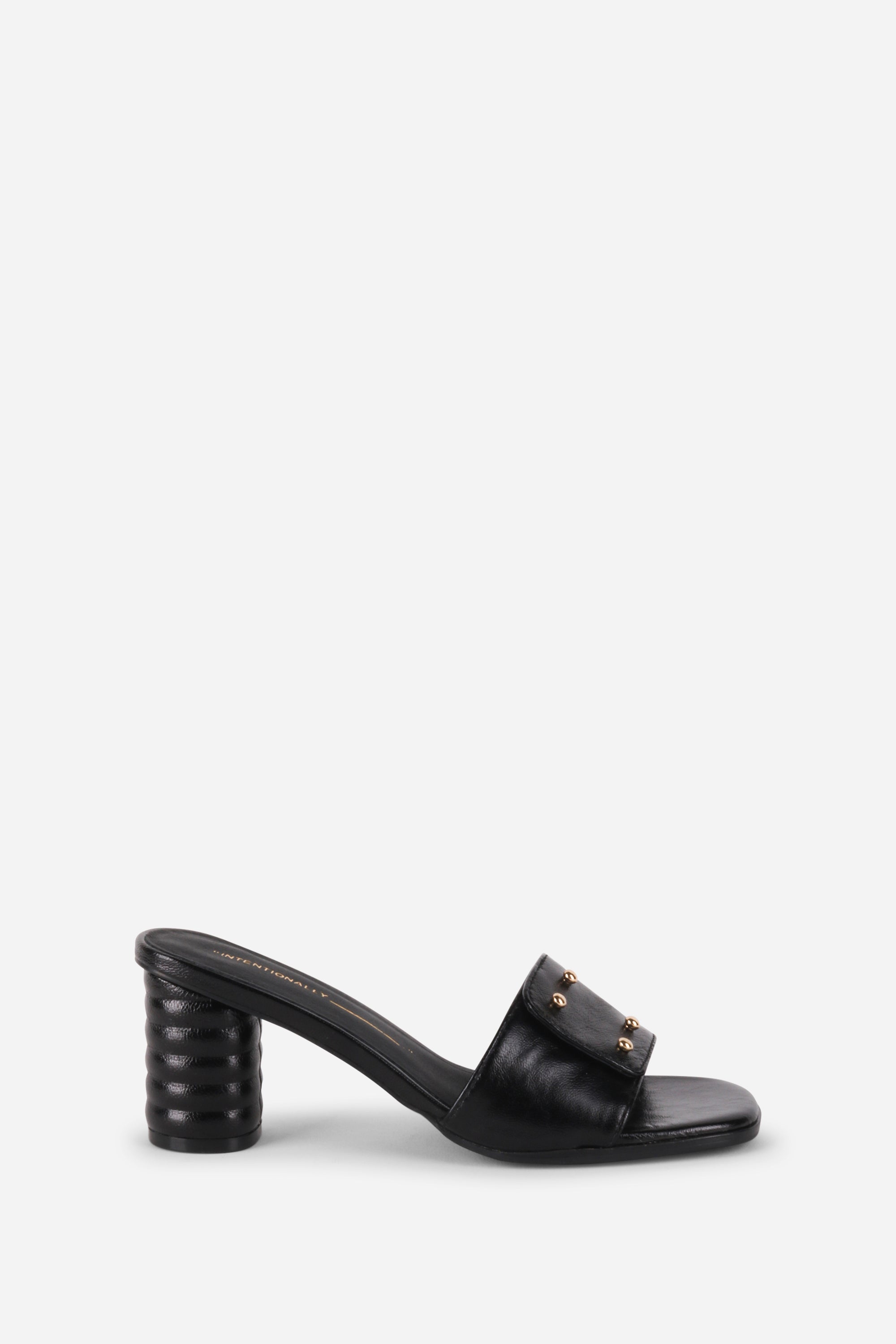 INTENTIONALLY __________. Kizmit Mule Heels