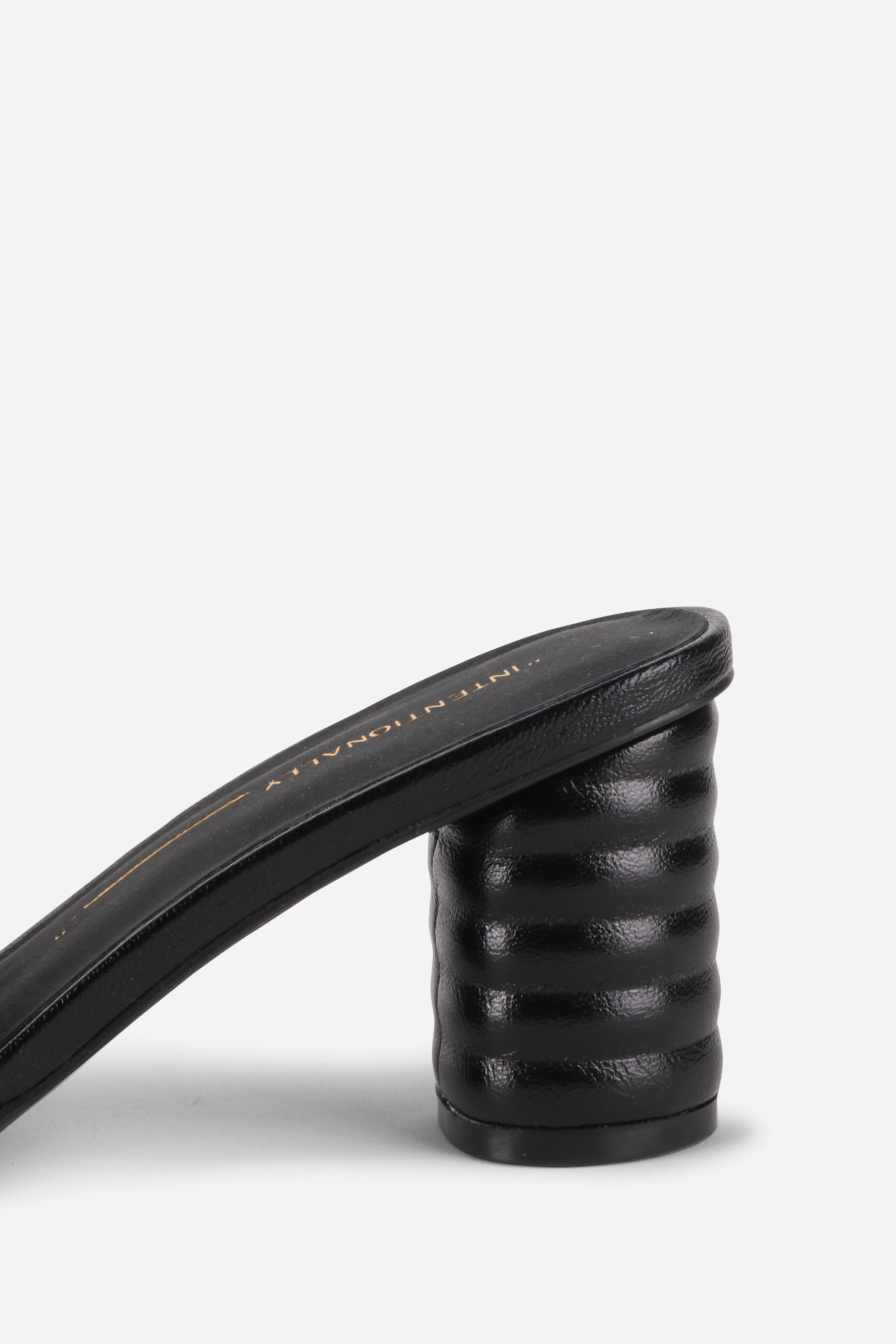 INTENTIONALLY __________. Kizmit Mule Heels