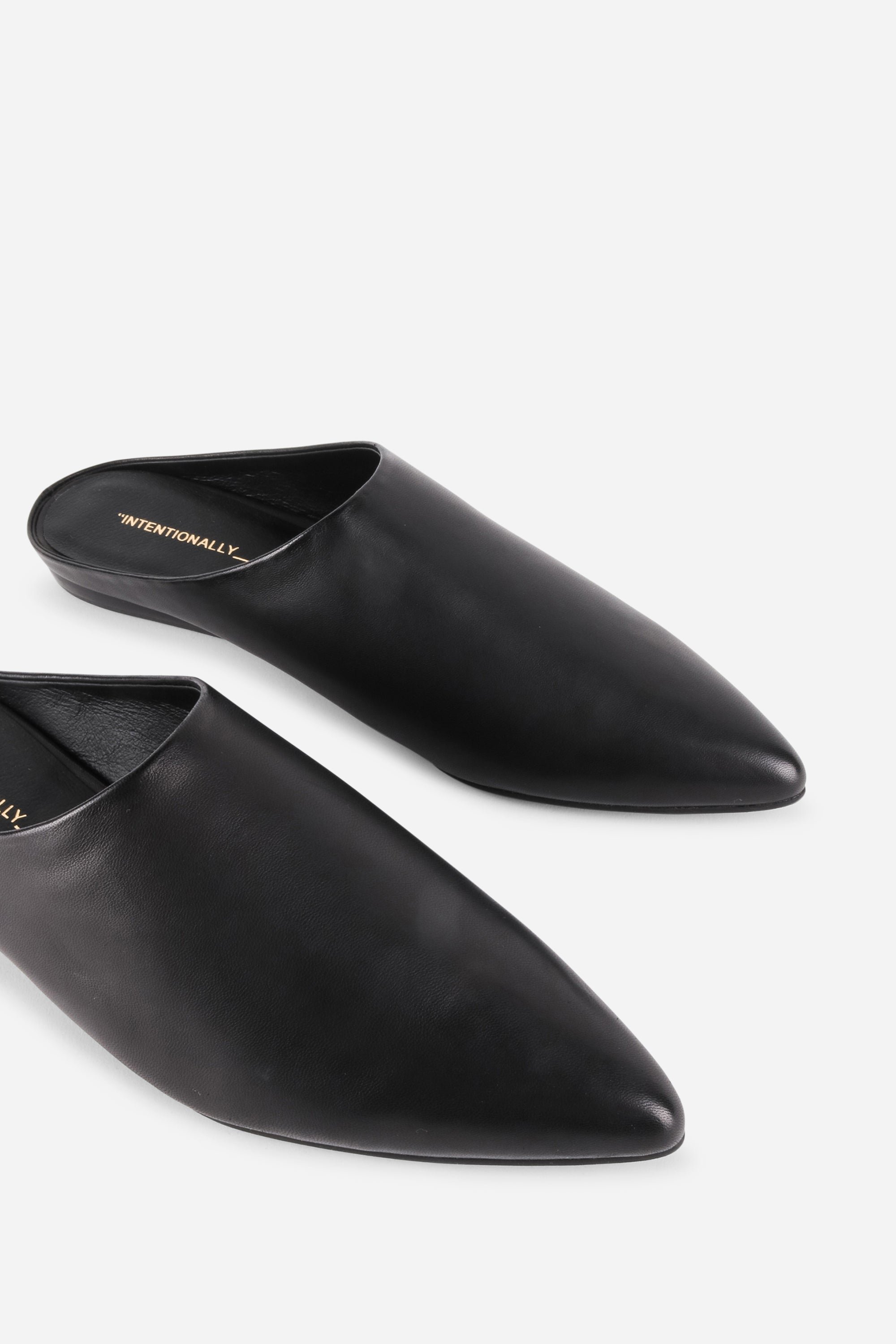 INTENTIONALLY __________. Major Leather Flat Mule - Black