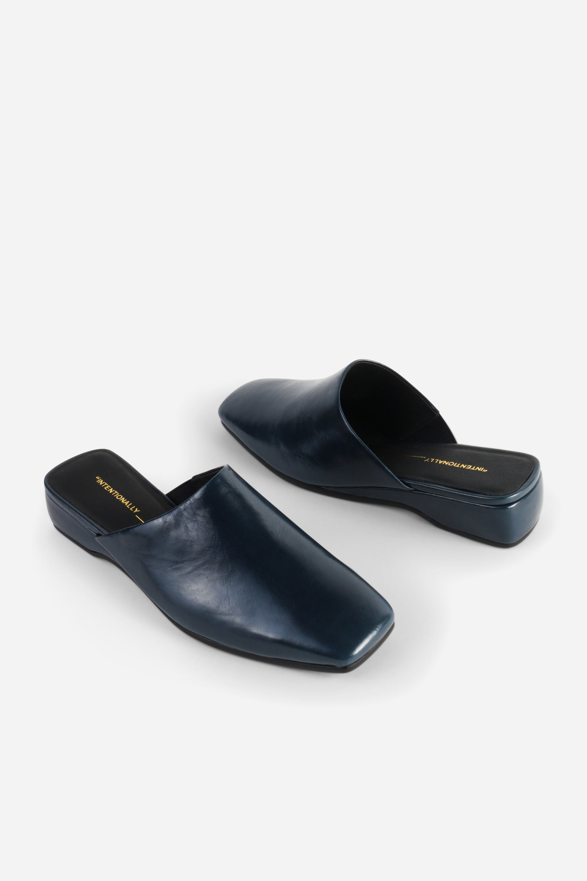 INTENTIONALLY __________. Marer Micro Wedge Heel Mule