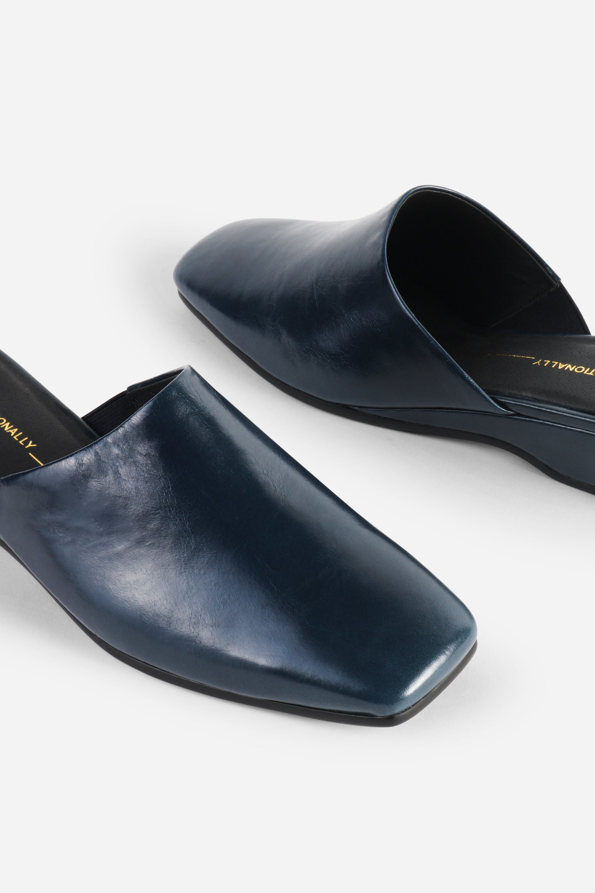 INTENTIONALLY __________. Marer Micro Wedge Heel Mule