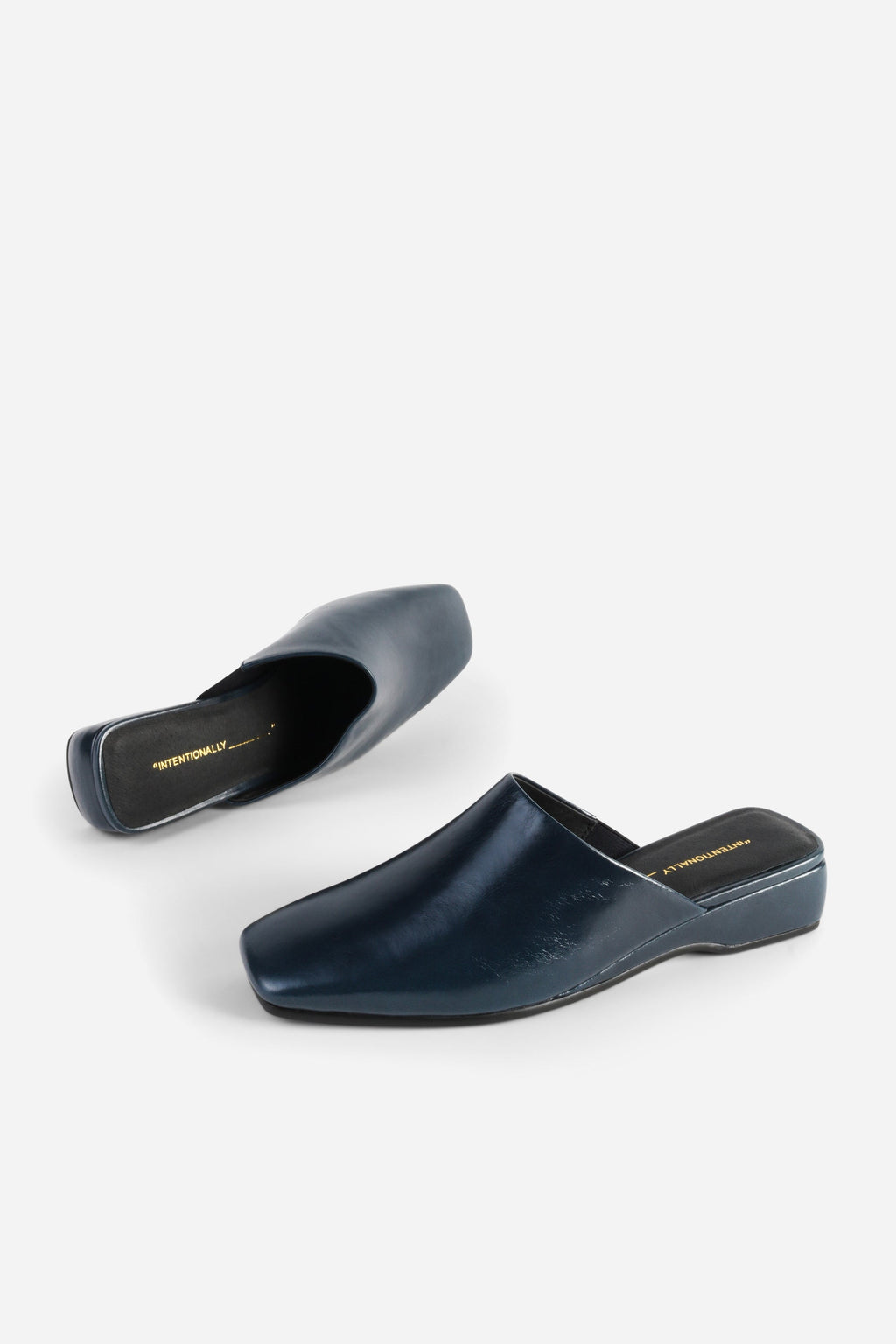 INTENTIONALLY __________. Marer Micro Wedge Heel Mule