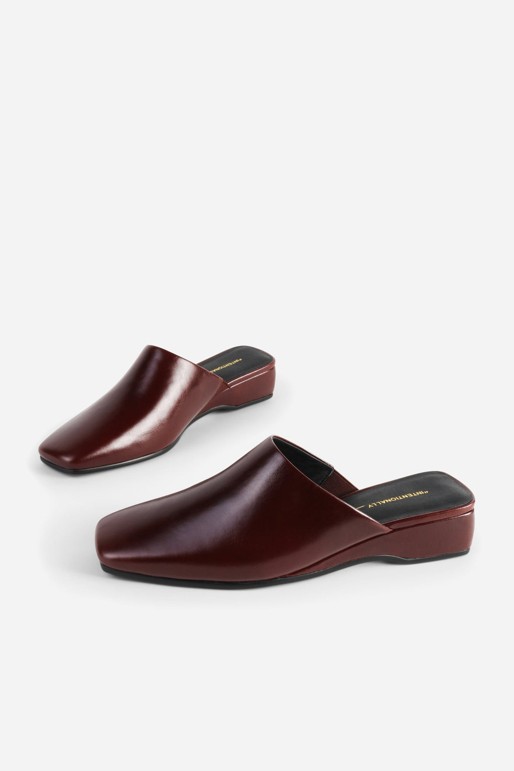 INTENTIONALLY __________. Marer Micro Wedge Heel Mule