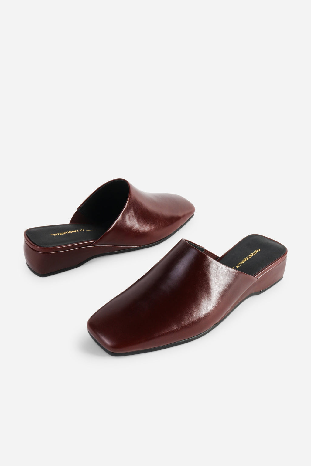 INTENTIONALLY __________. Marer Micro Wedge Heel Mule