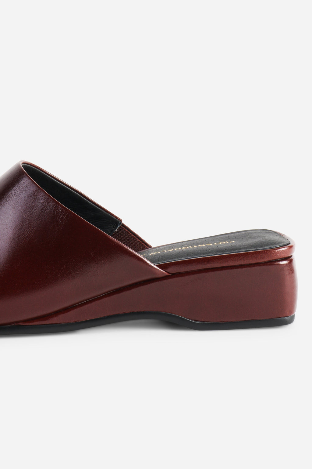 INTENTIONALLY __________. Marer Micro Wedge Heel Mule
