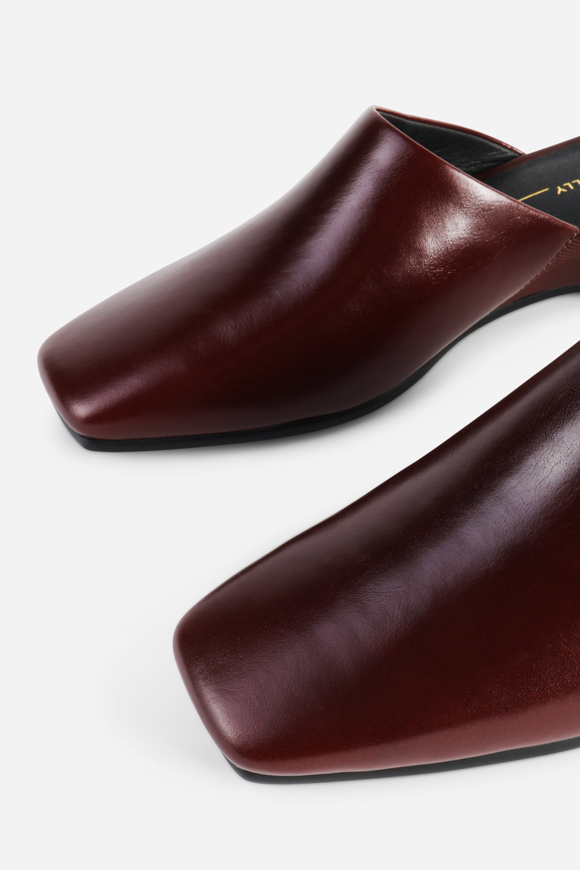 INTENTIONALLY __________. Marer Micro Wedge Heel Mule