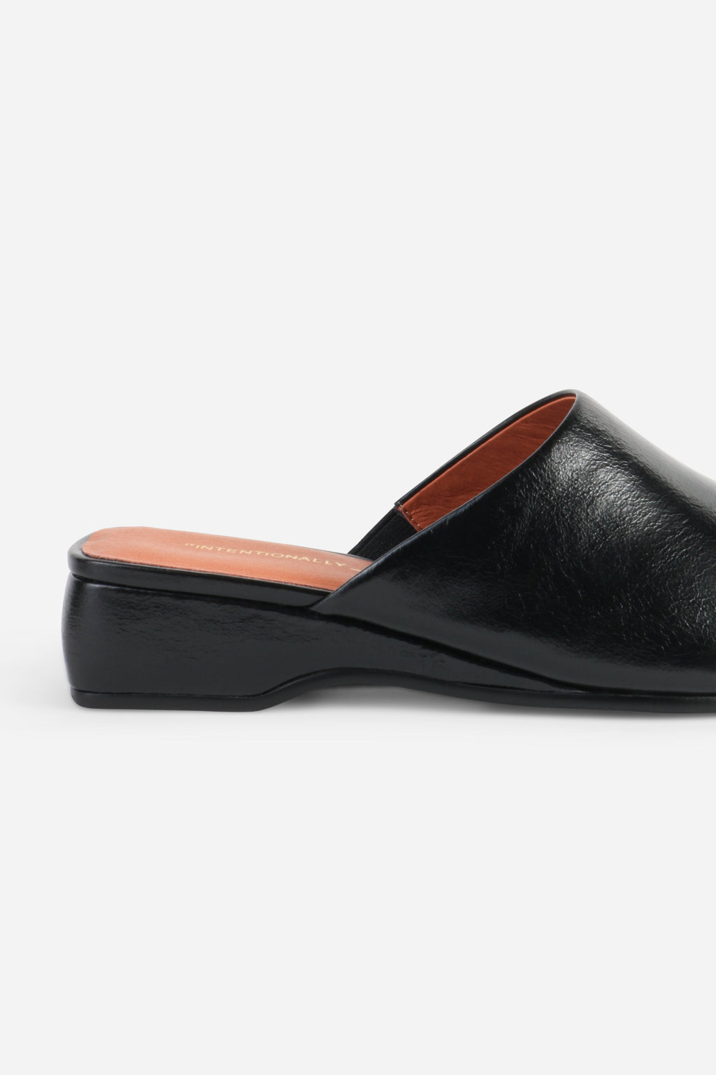 INTENTIONALLY __________. Marer Micro Wedge Heel Mule