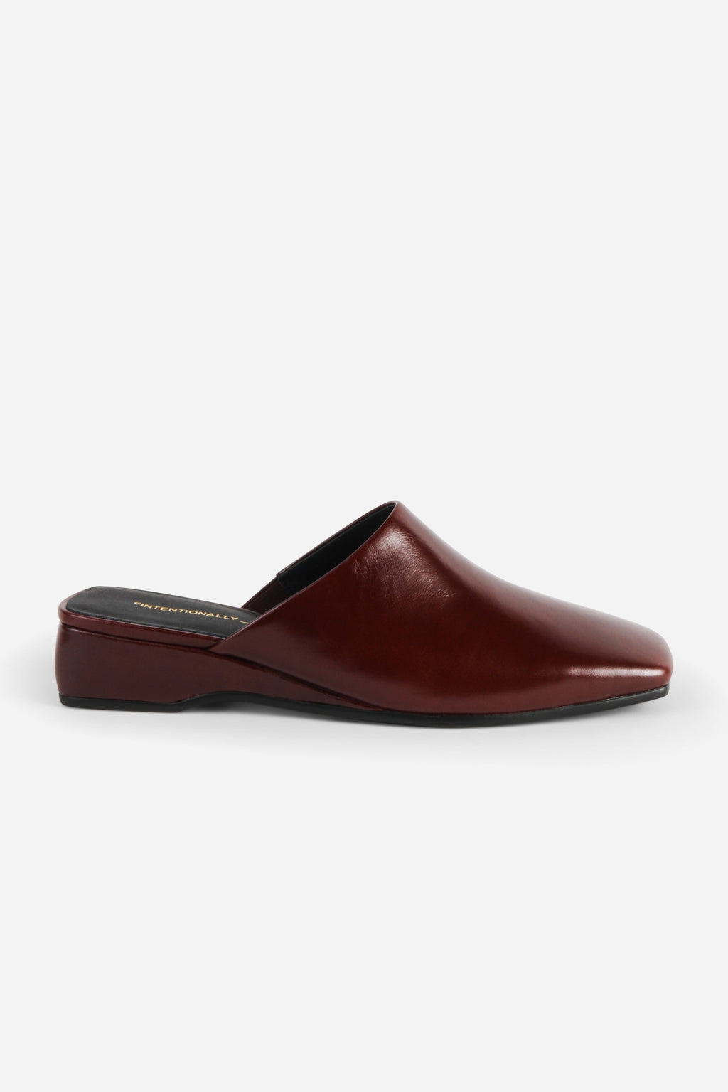 INTENTIONALLY __________. Marer Micro Wedge Heel Mule