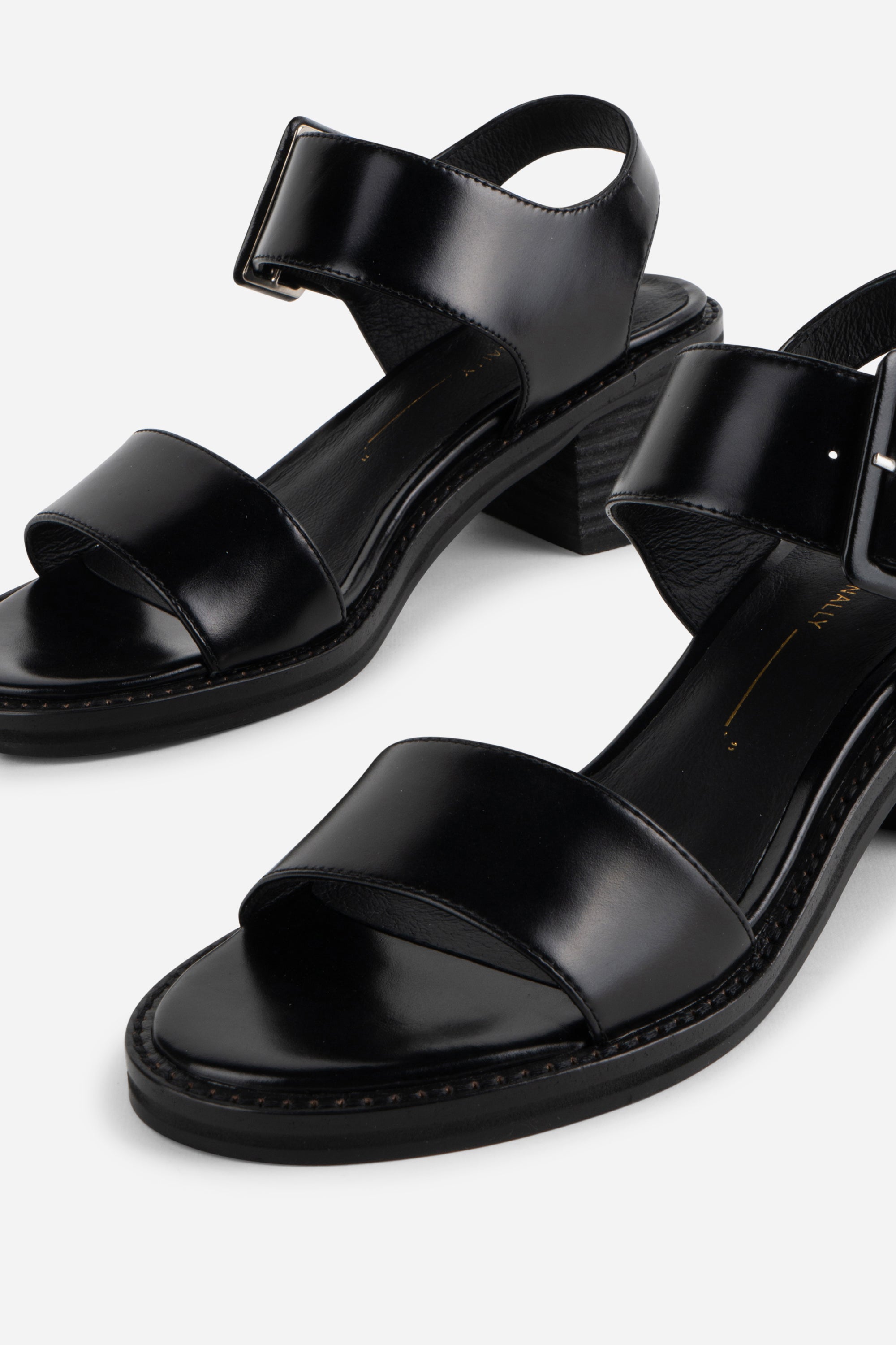 "INTENTIONALLY __________." Mazzy Stacked Heel City Sandal