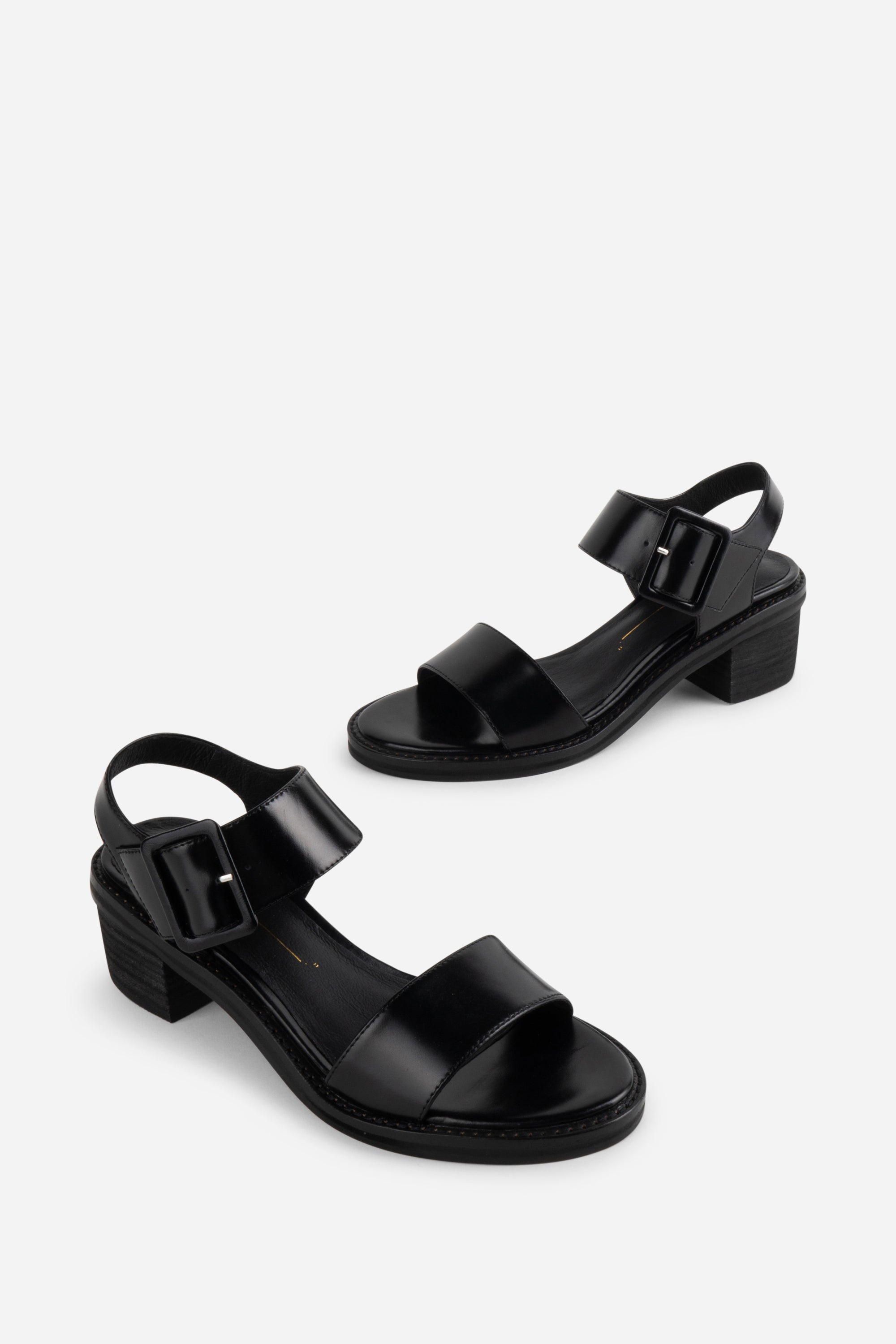 "INTENTIONALLY __________." Mazzy Stacked Heel City Sandal