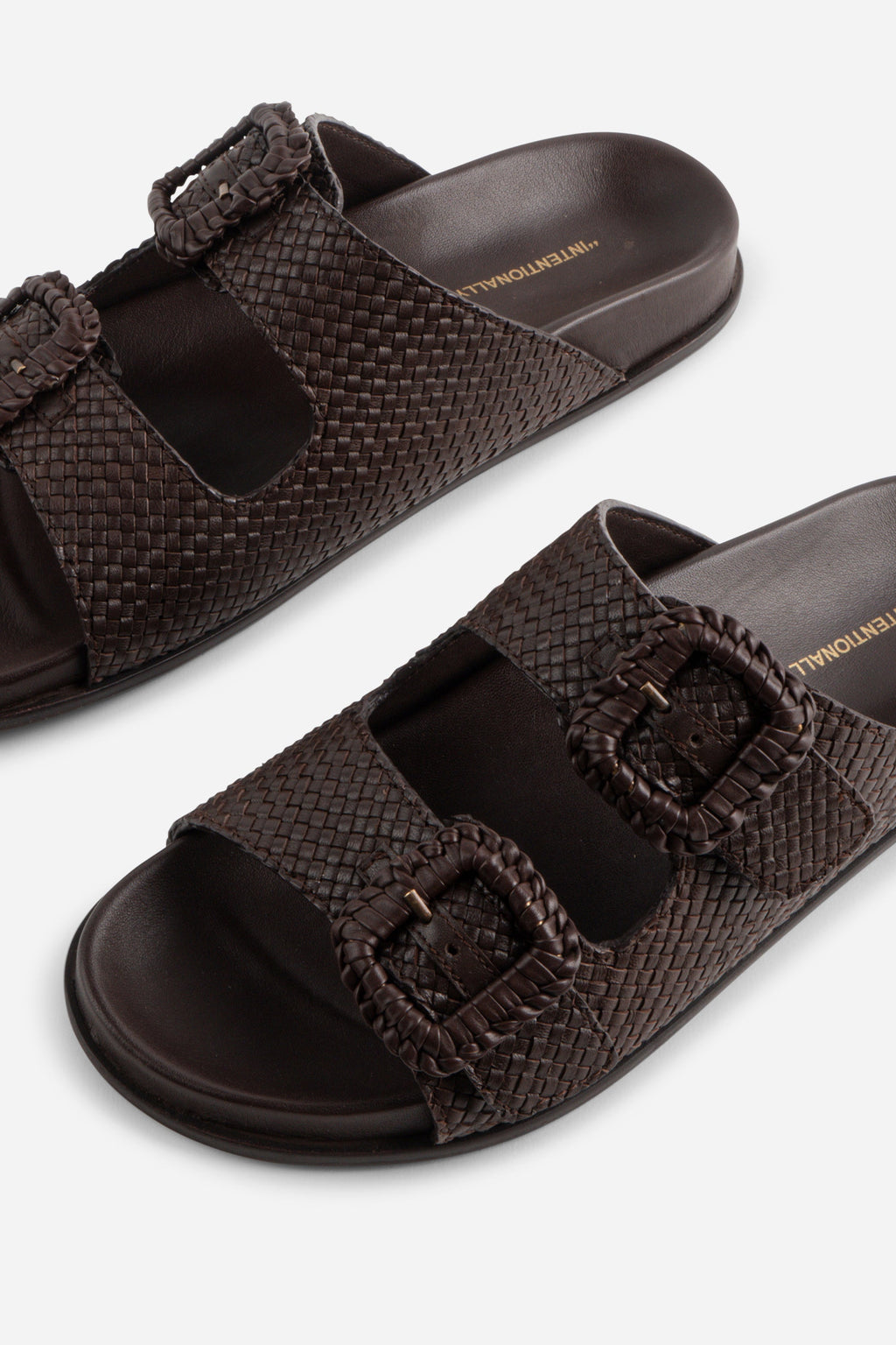 "INTENTIONALLY __________." Milano Sandal
