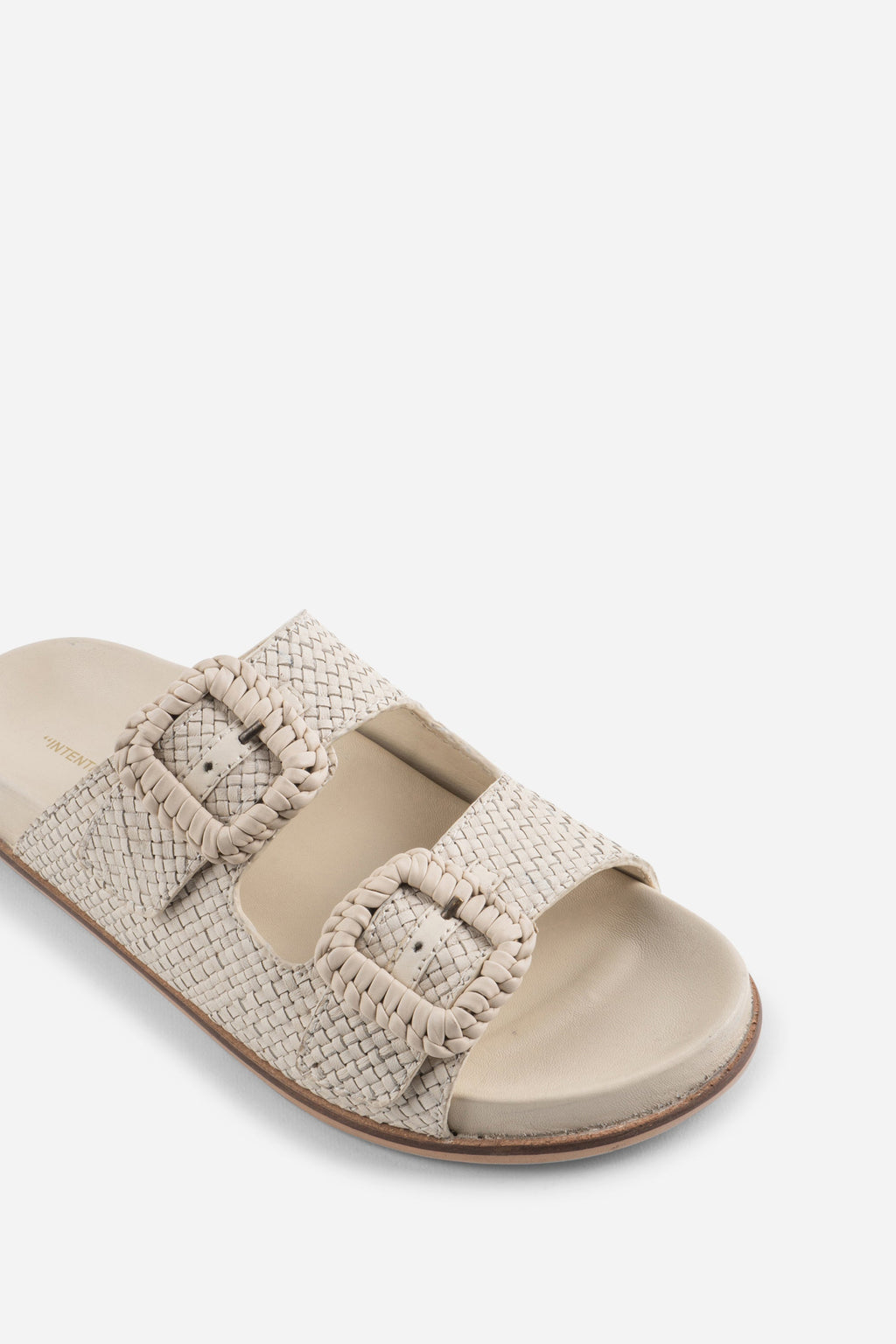 "INTENTIONALLY __________." Milano Sandal