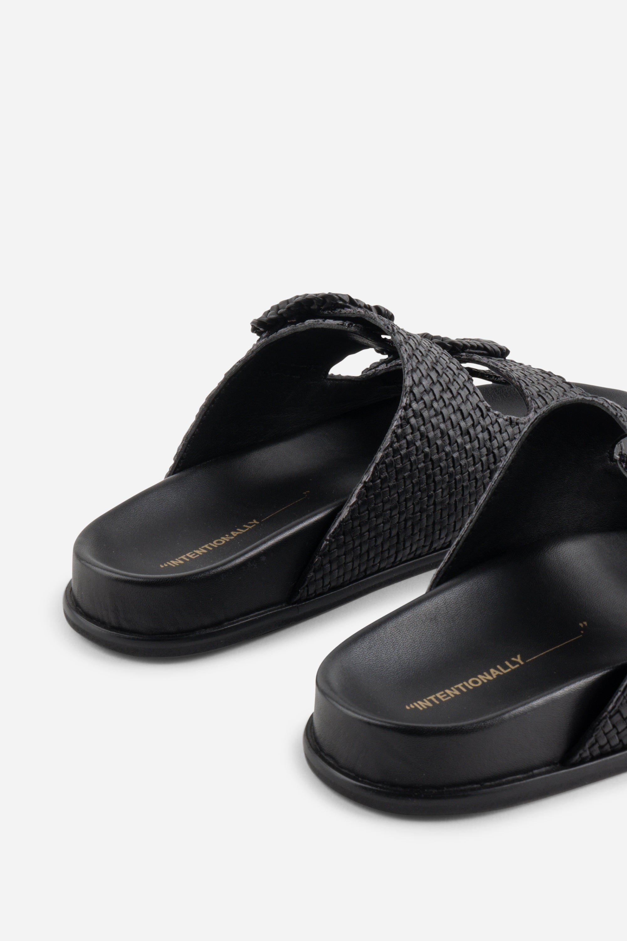 "INTENTIONALLY __________." Milano Sandal