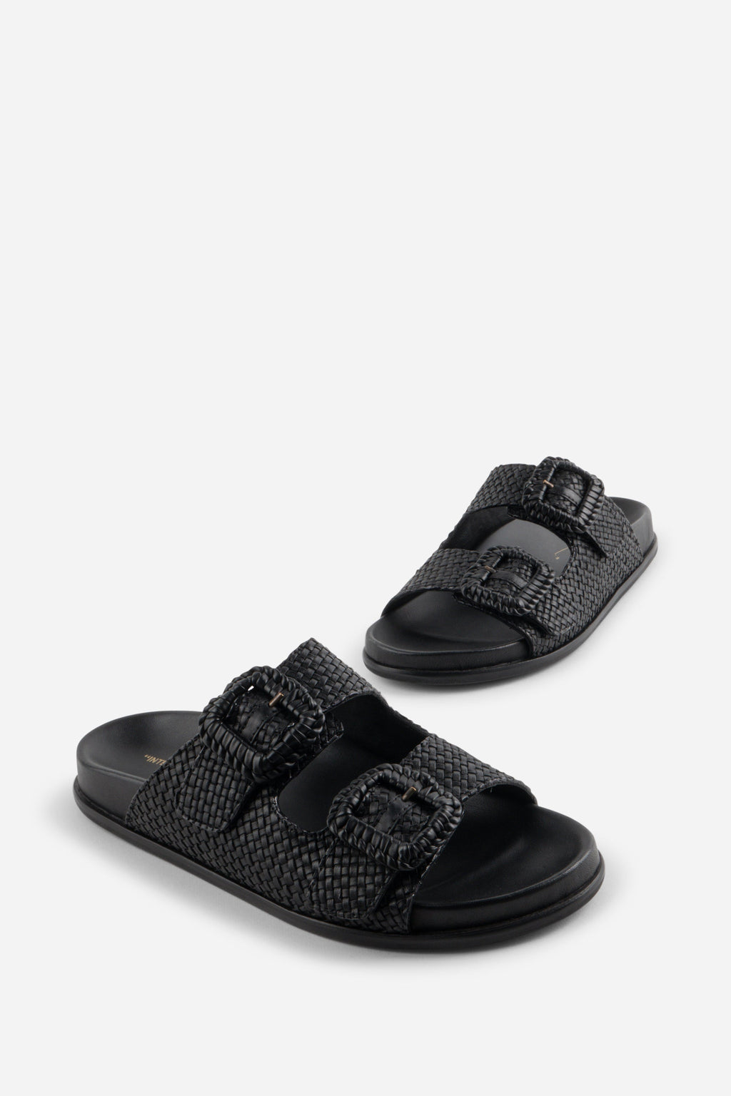 "INTENTIONALLY __________." Milano Sandal
