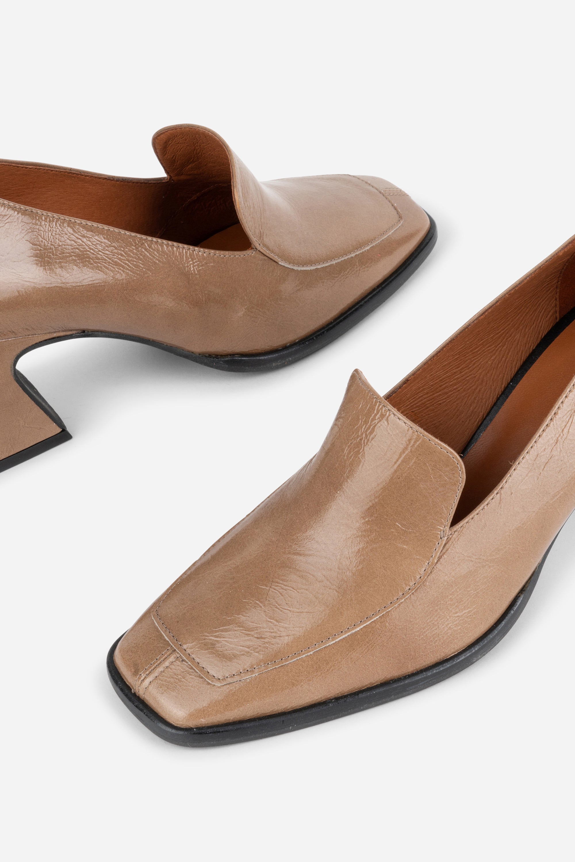 INTENTIONALLY __________. Mosa Heeled Loafer