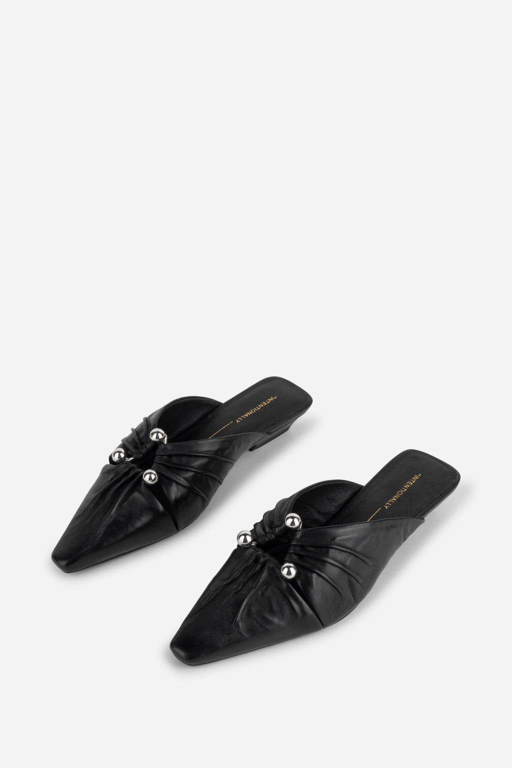 "INTENTIONALLY __________." Noah Pierced Mule