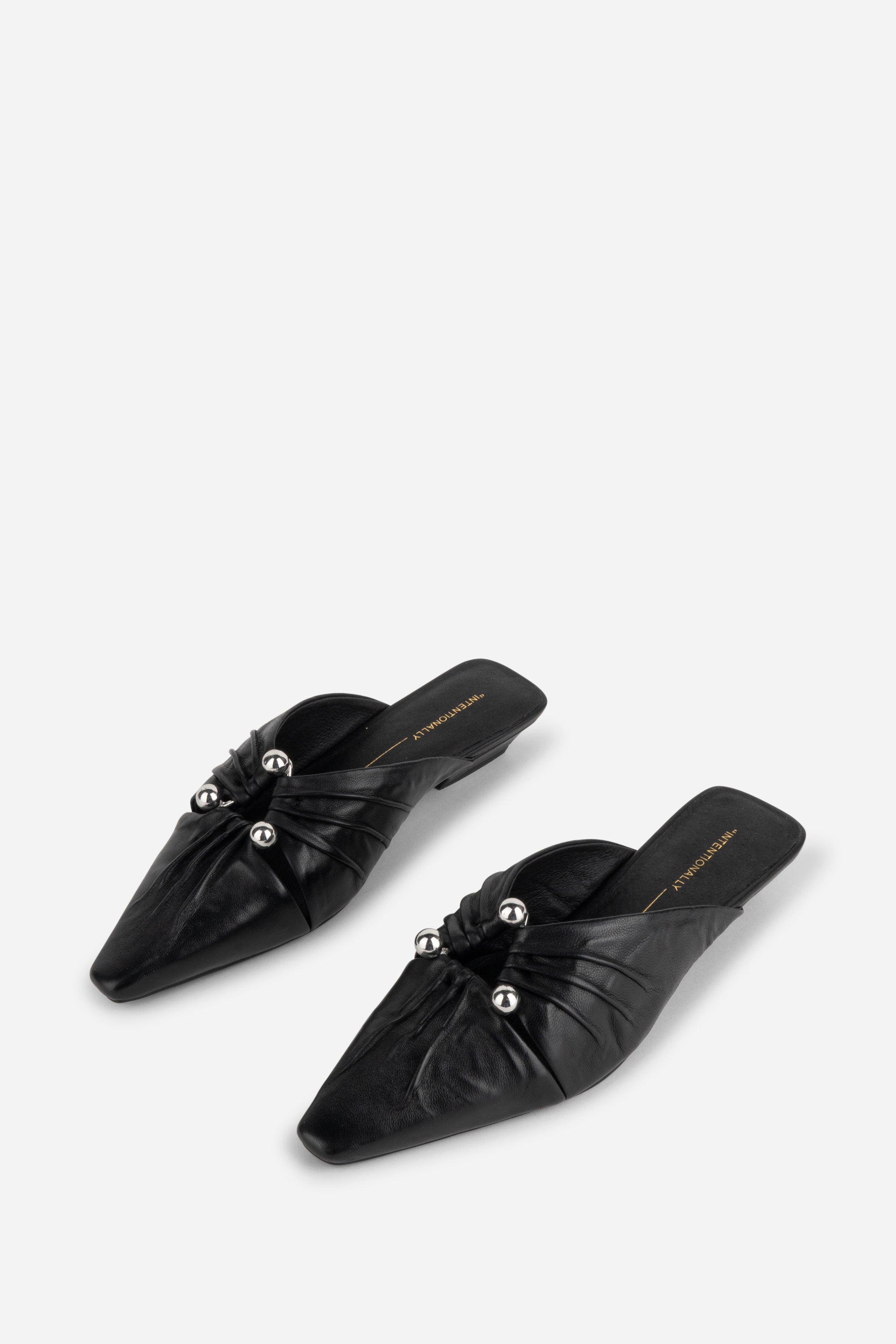 "INTENTIONALLY __________." Noah Pierced Mule