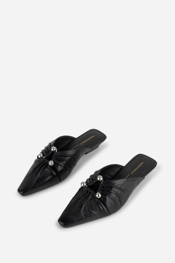"INTENTIONALLY __________." Noah Pierced Mule