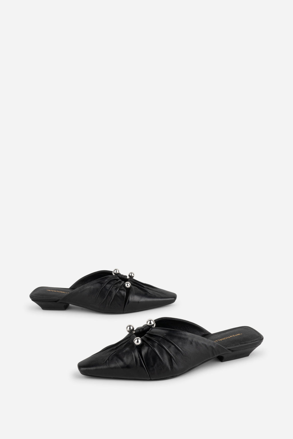 "INTENTIONALLY __________." Noah Pierced Mule