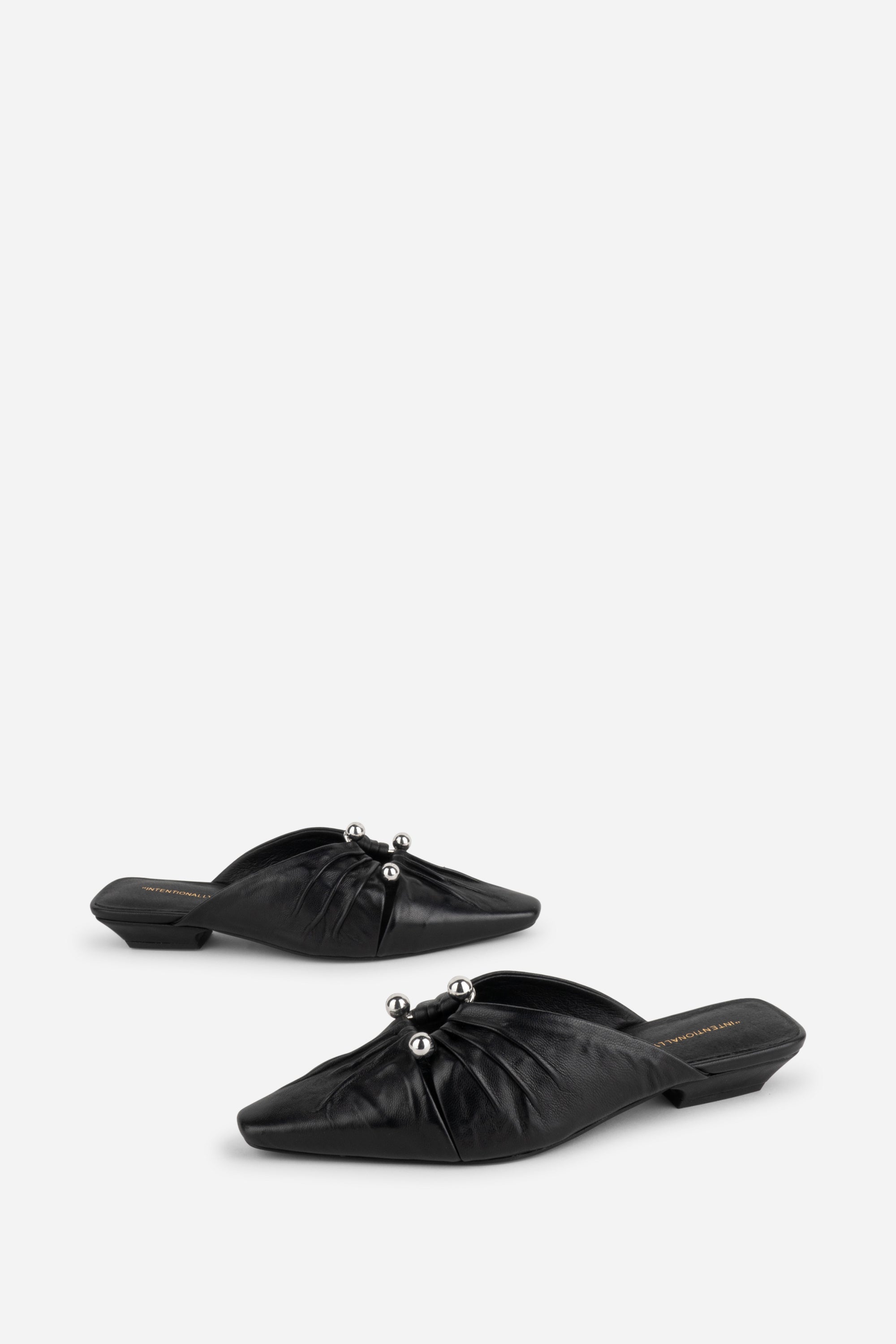 "INTENTIONALLY __________." Noah Pierced Mule