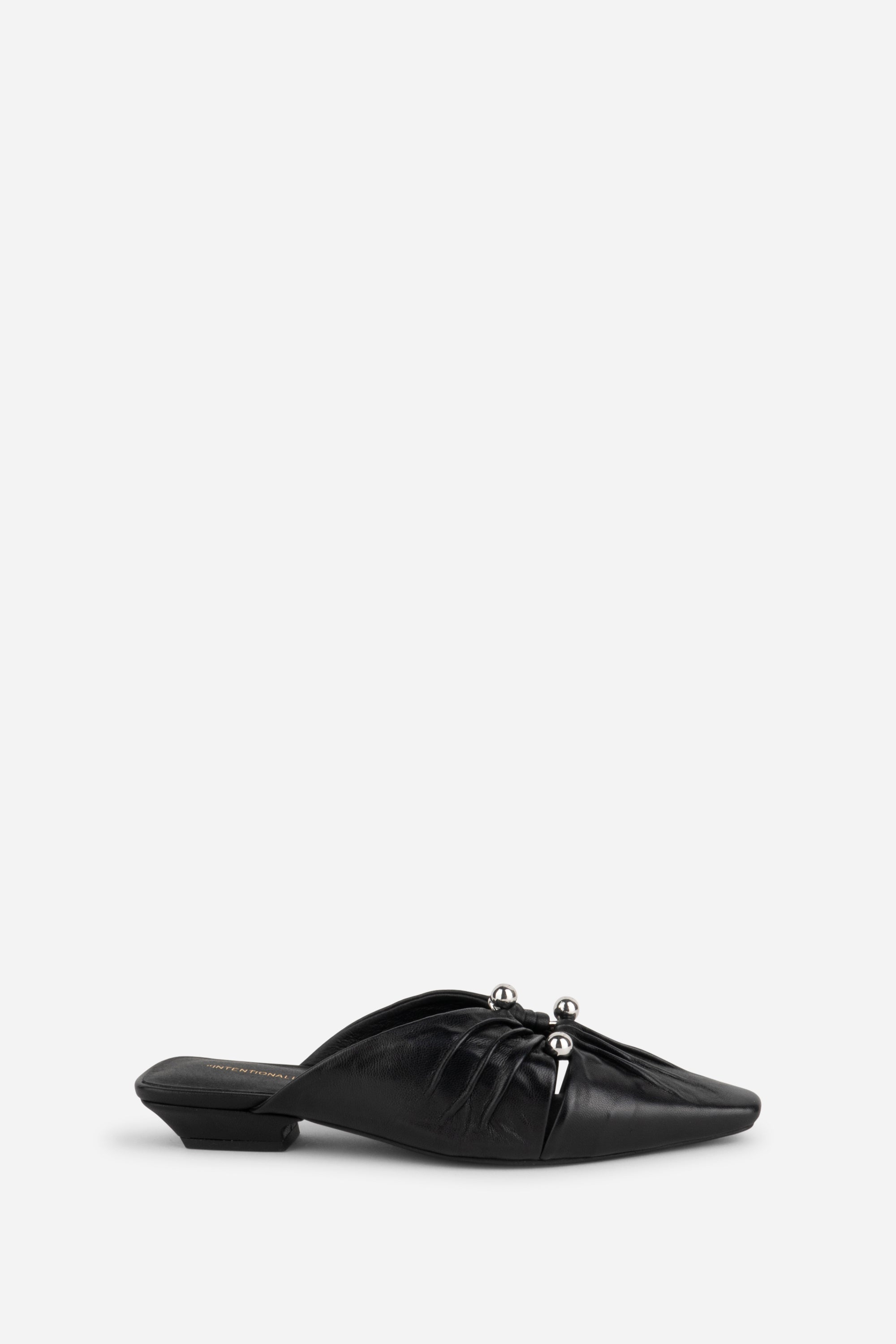 "INTENTIONALLY __________." Noah Pierced Mule