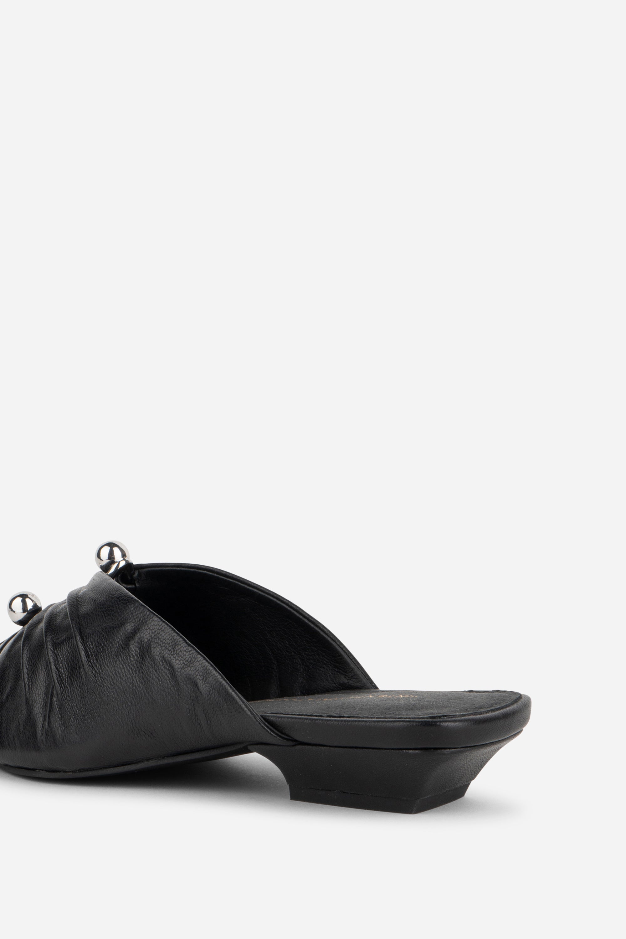 "INTENTIONALLY __________." Noah Pierced Mule