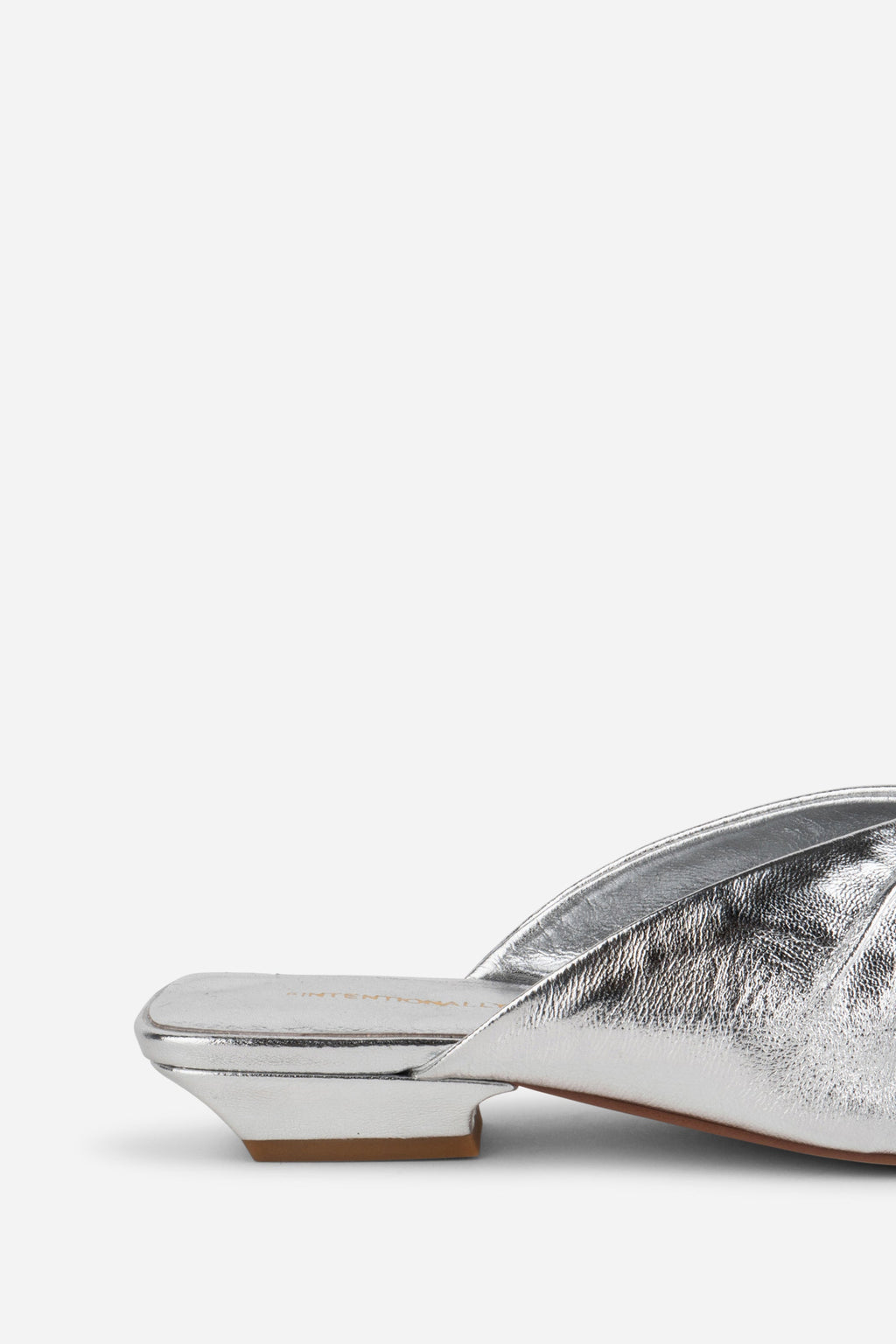 "INTENTIONALLY __________." Noah Pierced Mule