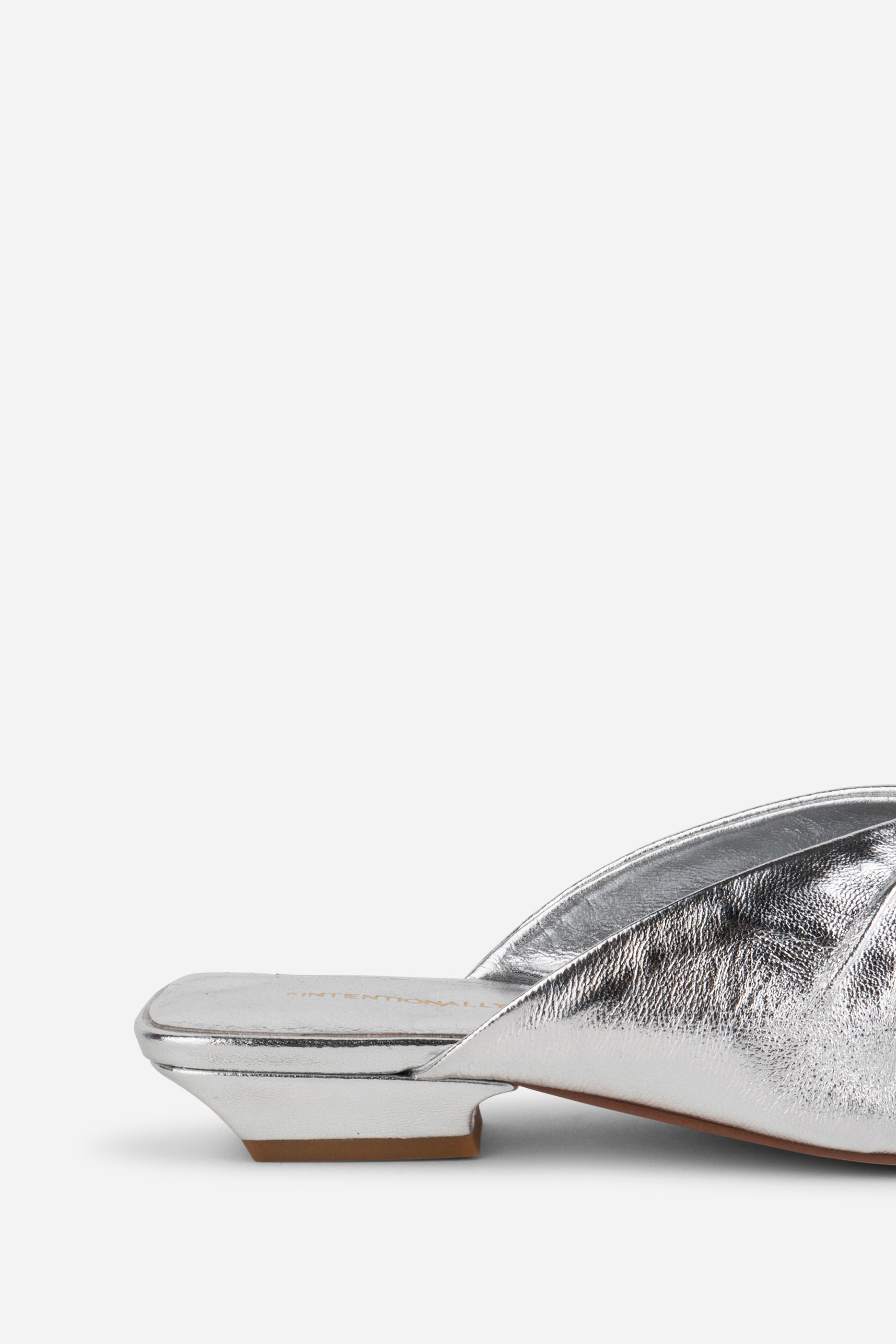 "INTENTIONALLY __________." Noah Pierced Mule