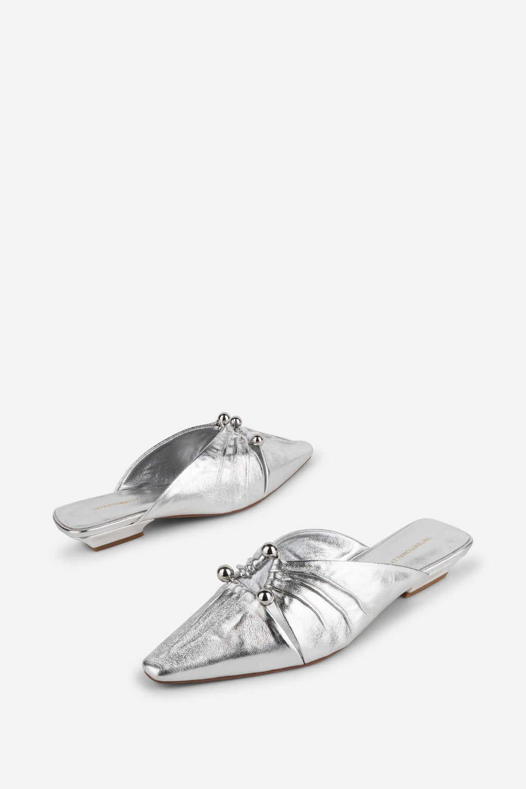 "INTENTIONALLY __________." Noah Pierced Mule