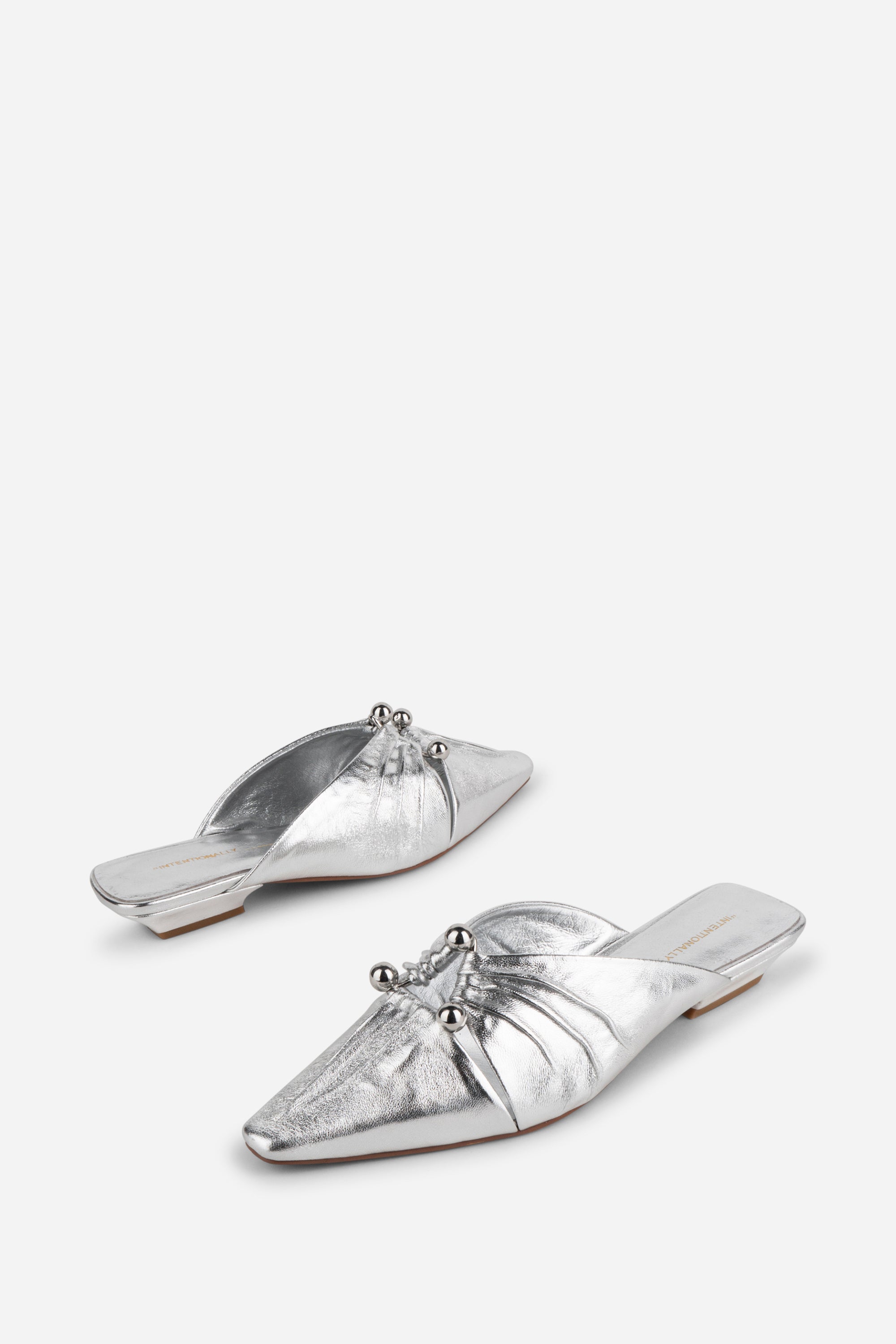 "INTENTIONALLY __________." Noah Pierced Mule