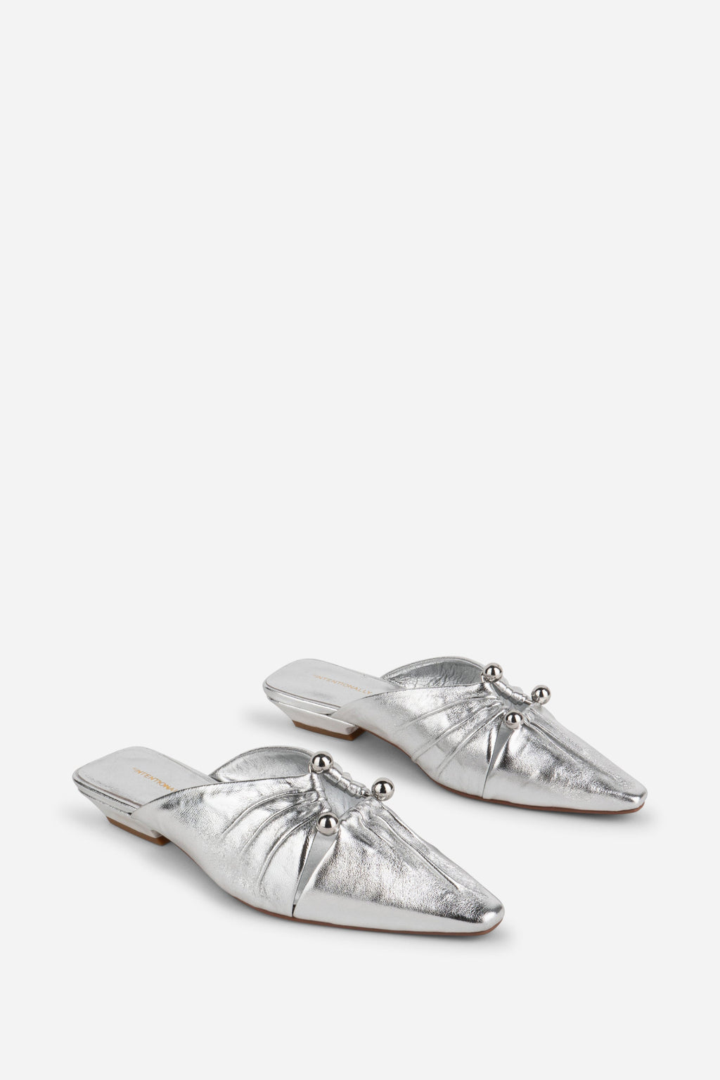 "INTENTIONALLY __________." Noah Pierced Mule