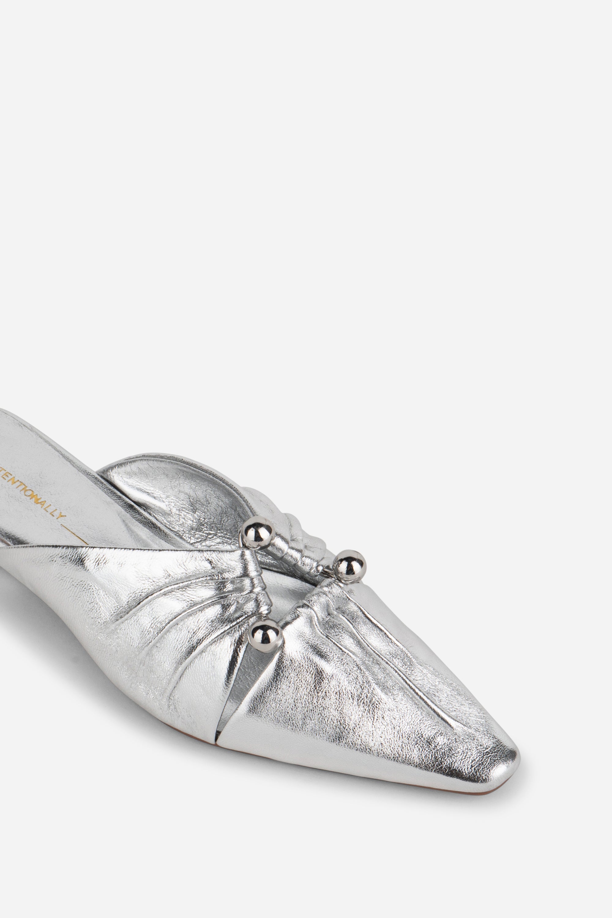 "INTENTIONALLY __________." Noah Pierced Mule