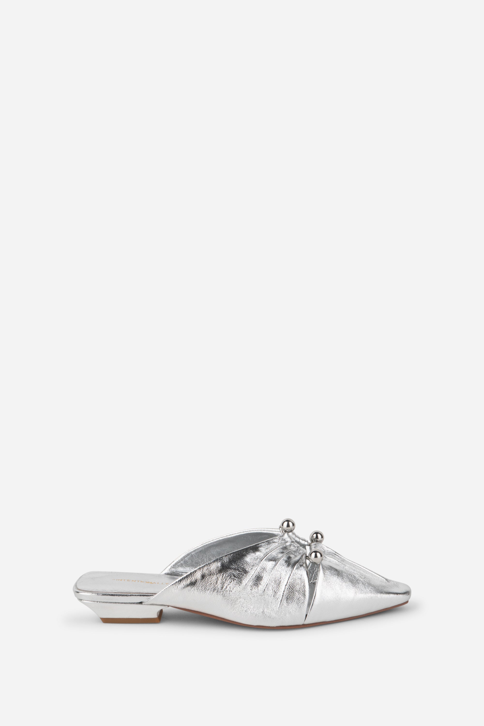 "INTENTIONALLY __________." Noah Pierced Mule