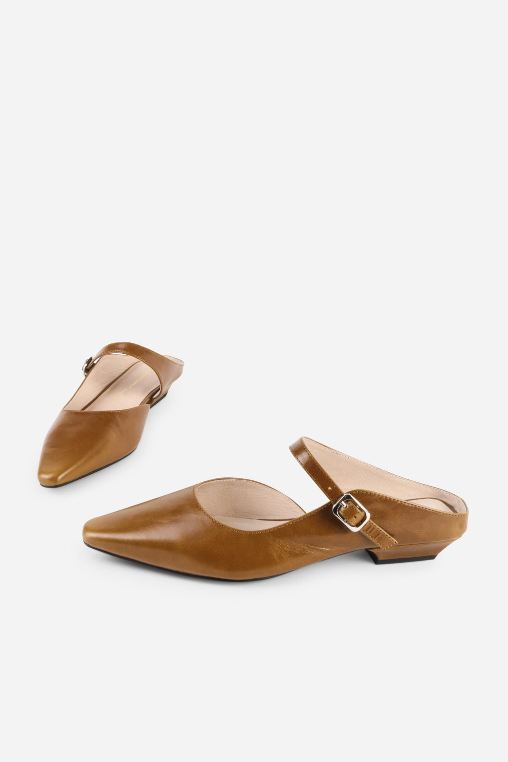 INTENTIONALLY __________. Nona Leather Flat Mule