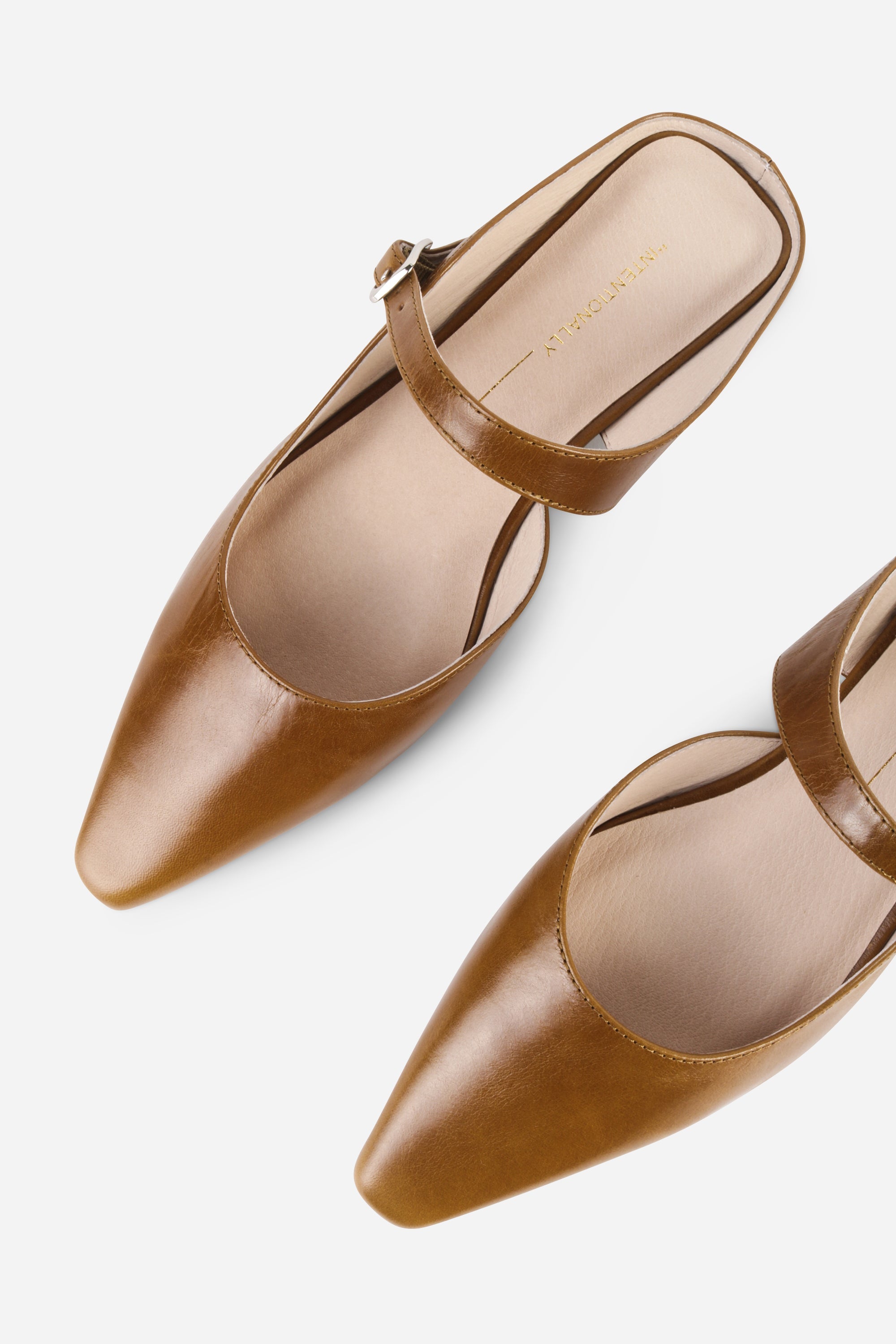 INTENTIONALLY __________. Nona Leather Flat Mule