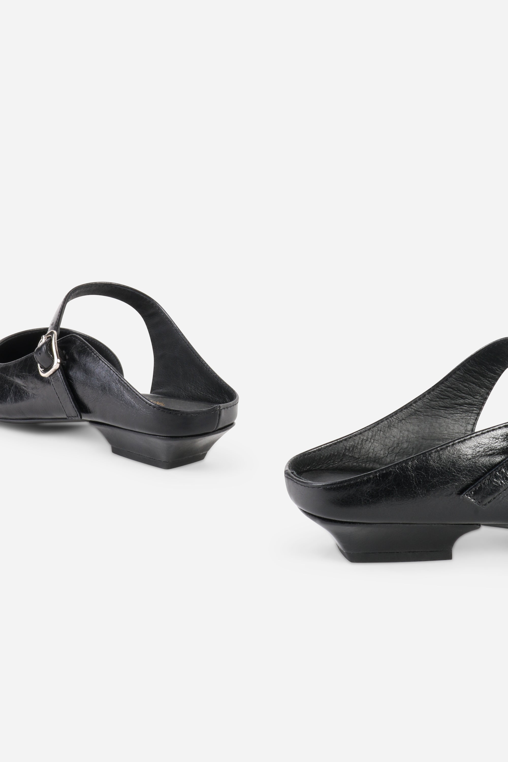 INTENTIONALLY __________. Nona Leather Flat Mule
