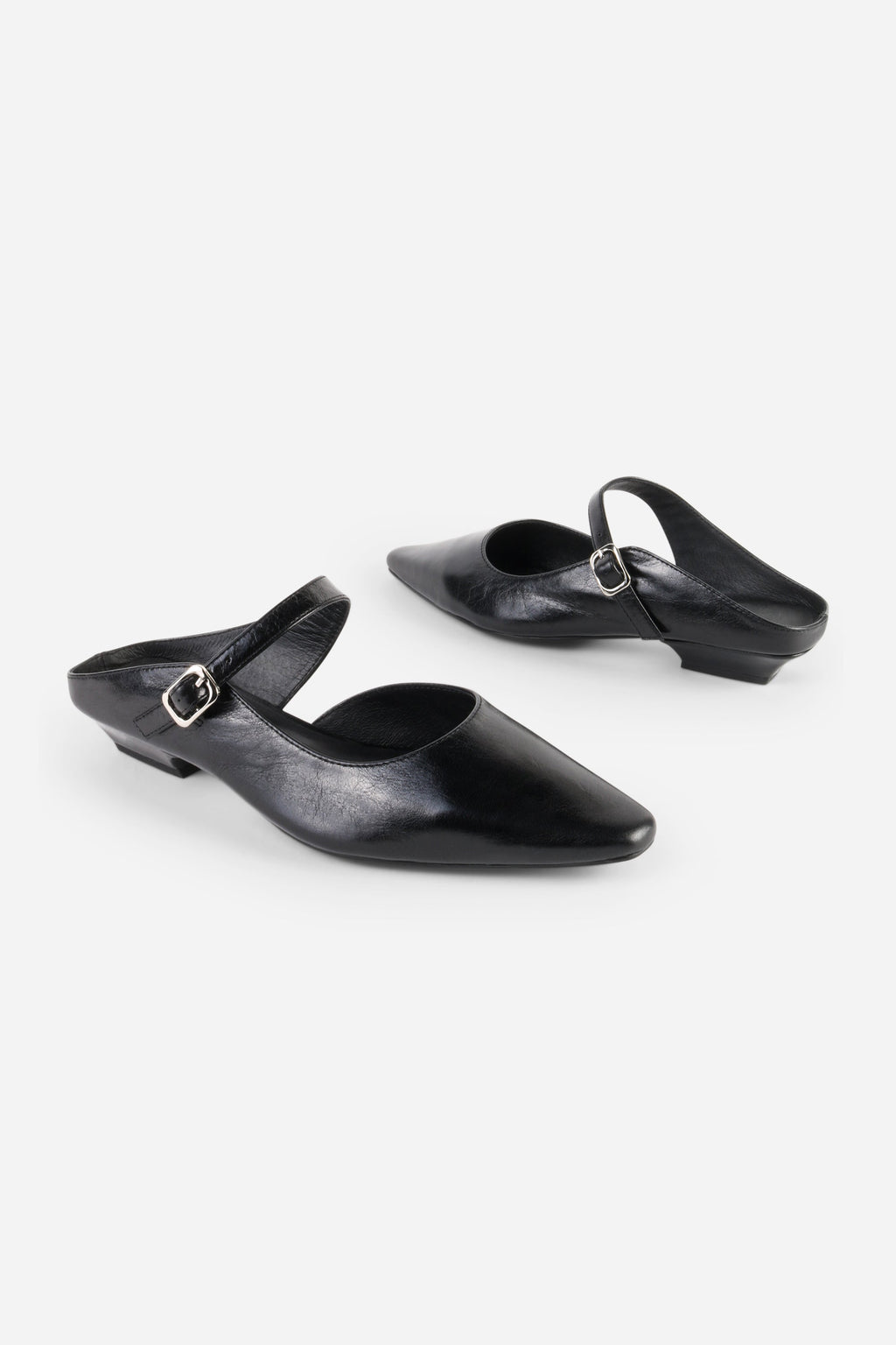INTENTIONALLY __________. Nona Leather Flat Mule
