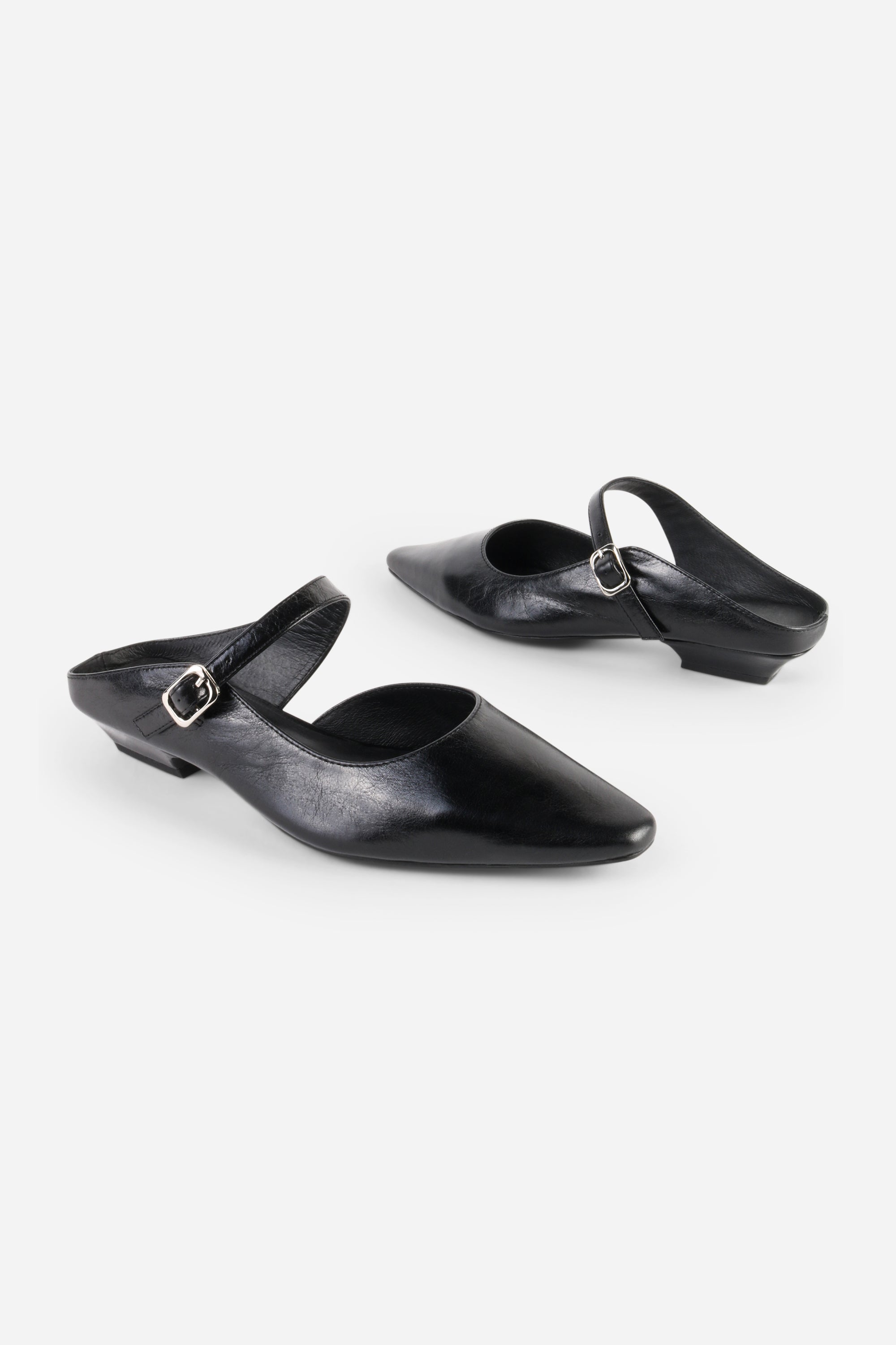 INTENTIONALLY __________. Nona Leather Flat Mule