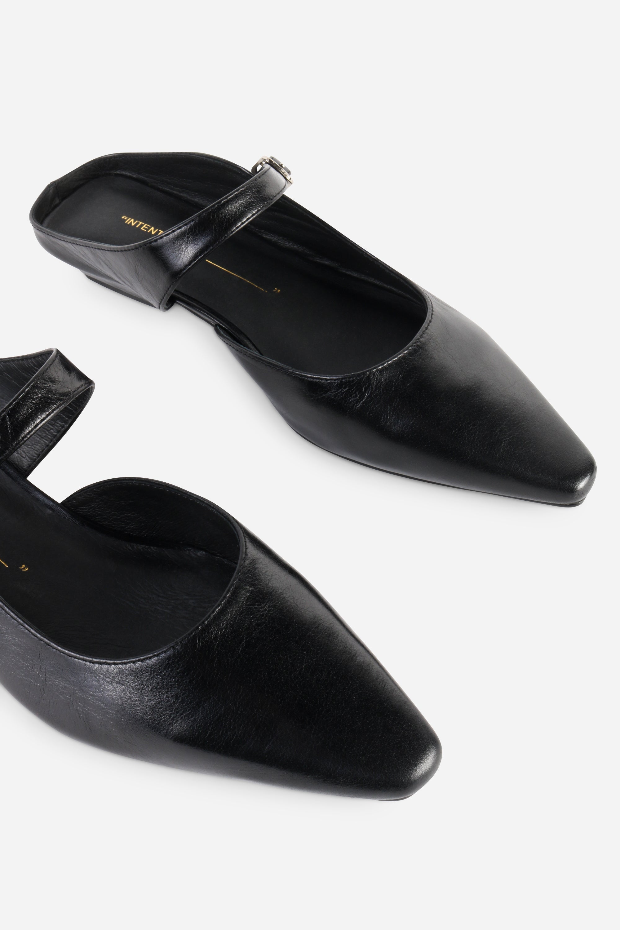 INTENTIONALLY __________. Nona Leather Flat Mule