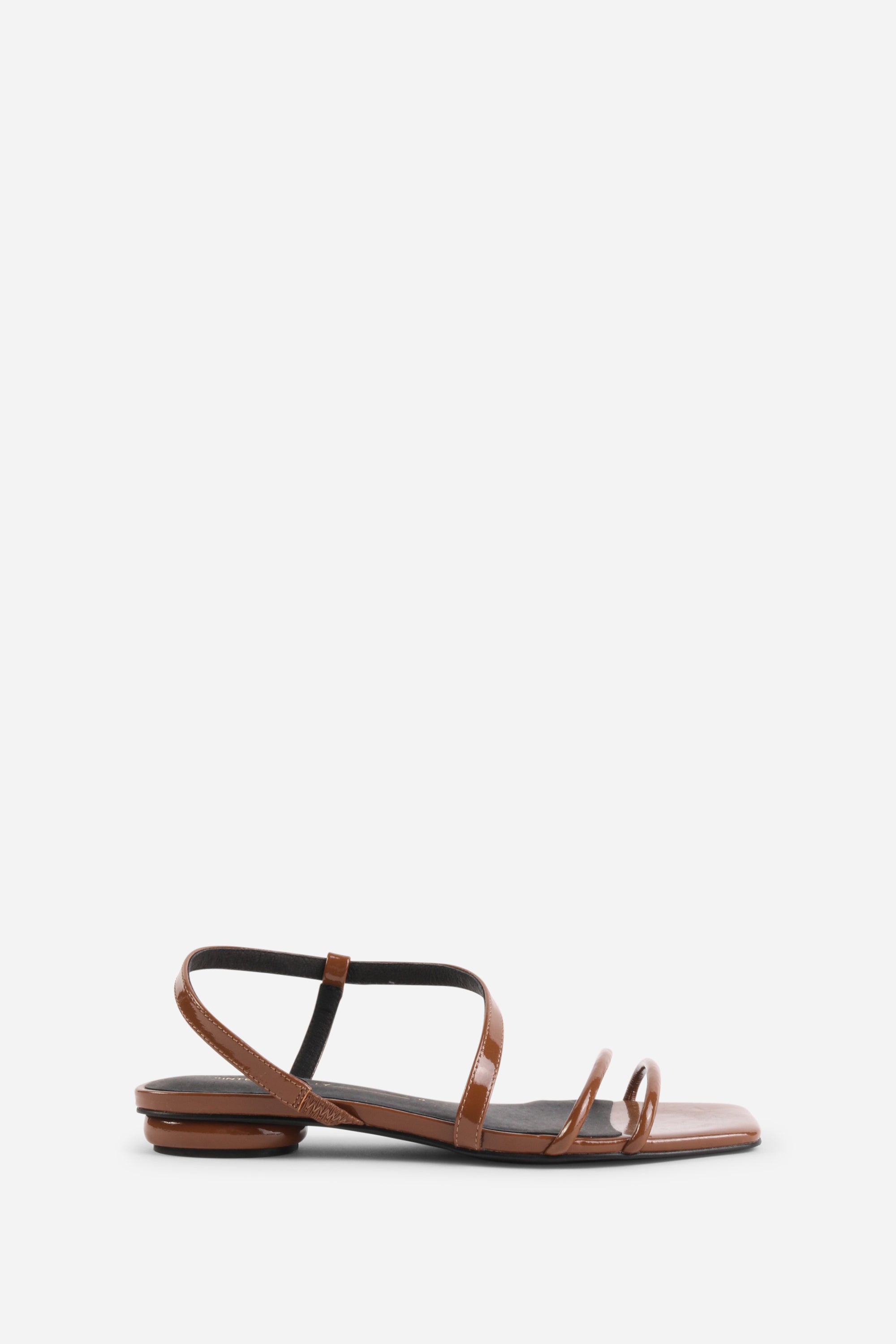 INTENTIONALLY __________. Nonfiction Flat Sandal
