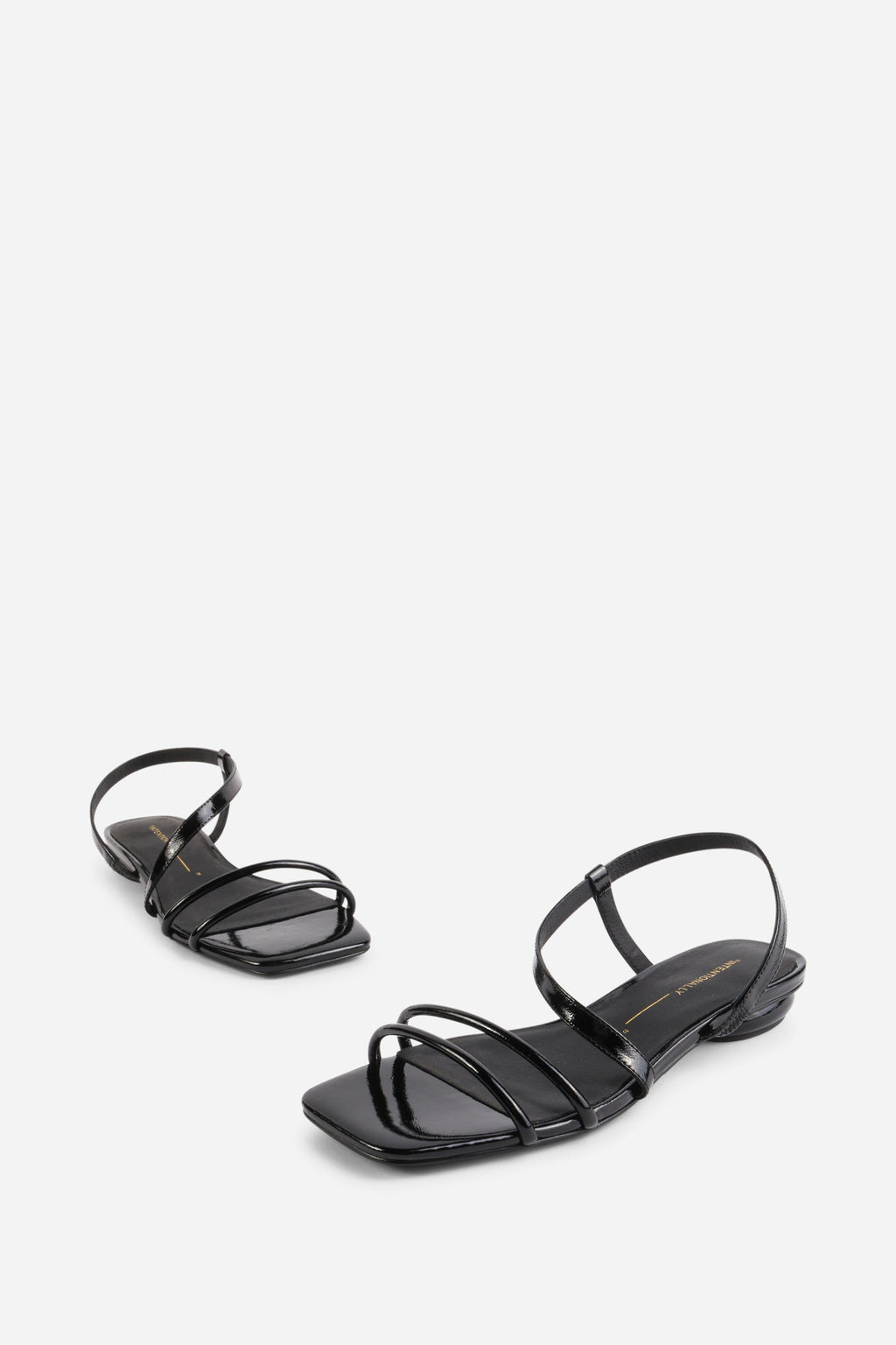 INTENTIONALLY __________. Nonfiction Flat Sandal