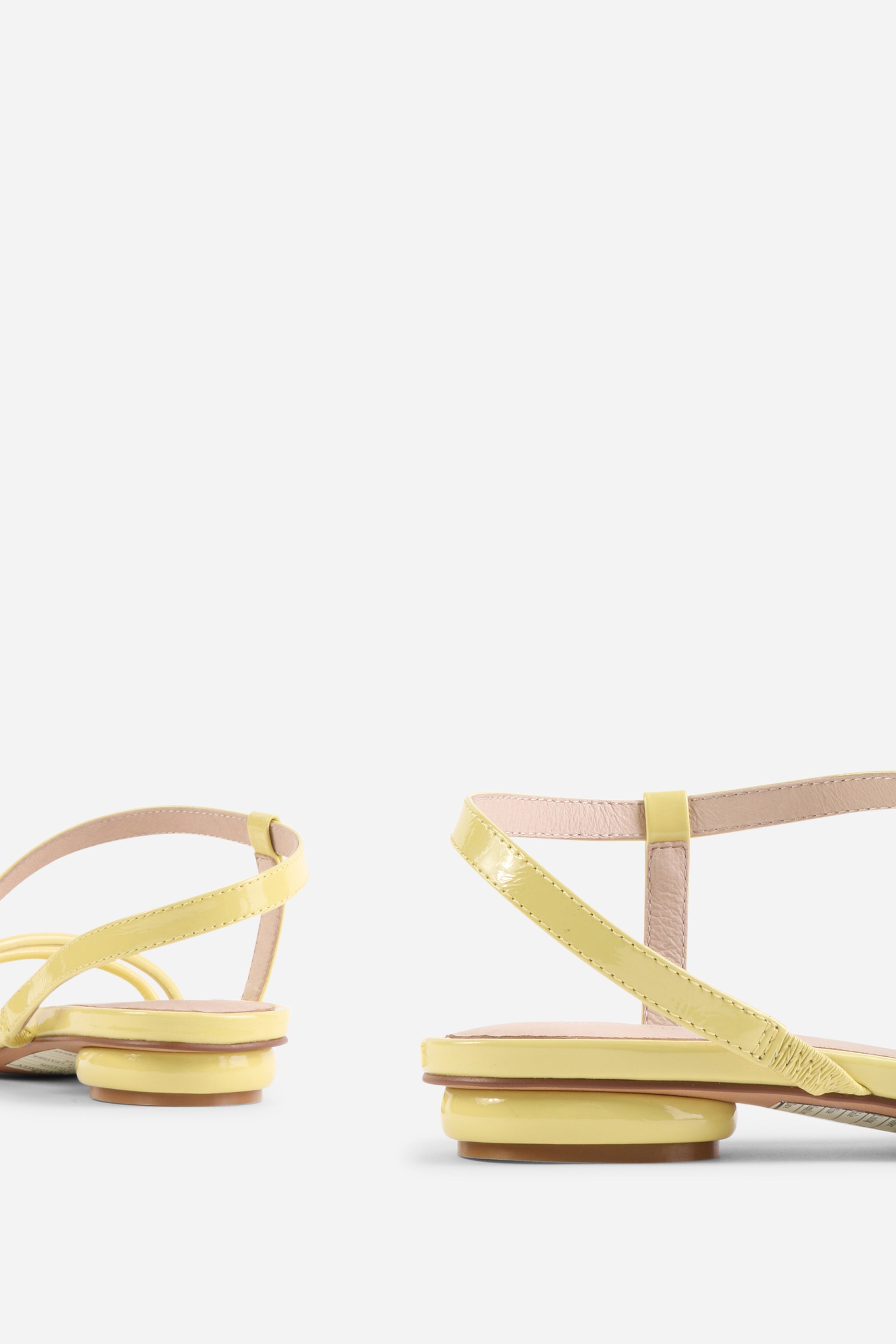 INTENTIONALLY __________. Nonfiction Flat Sandal