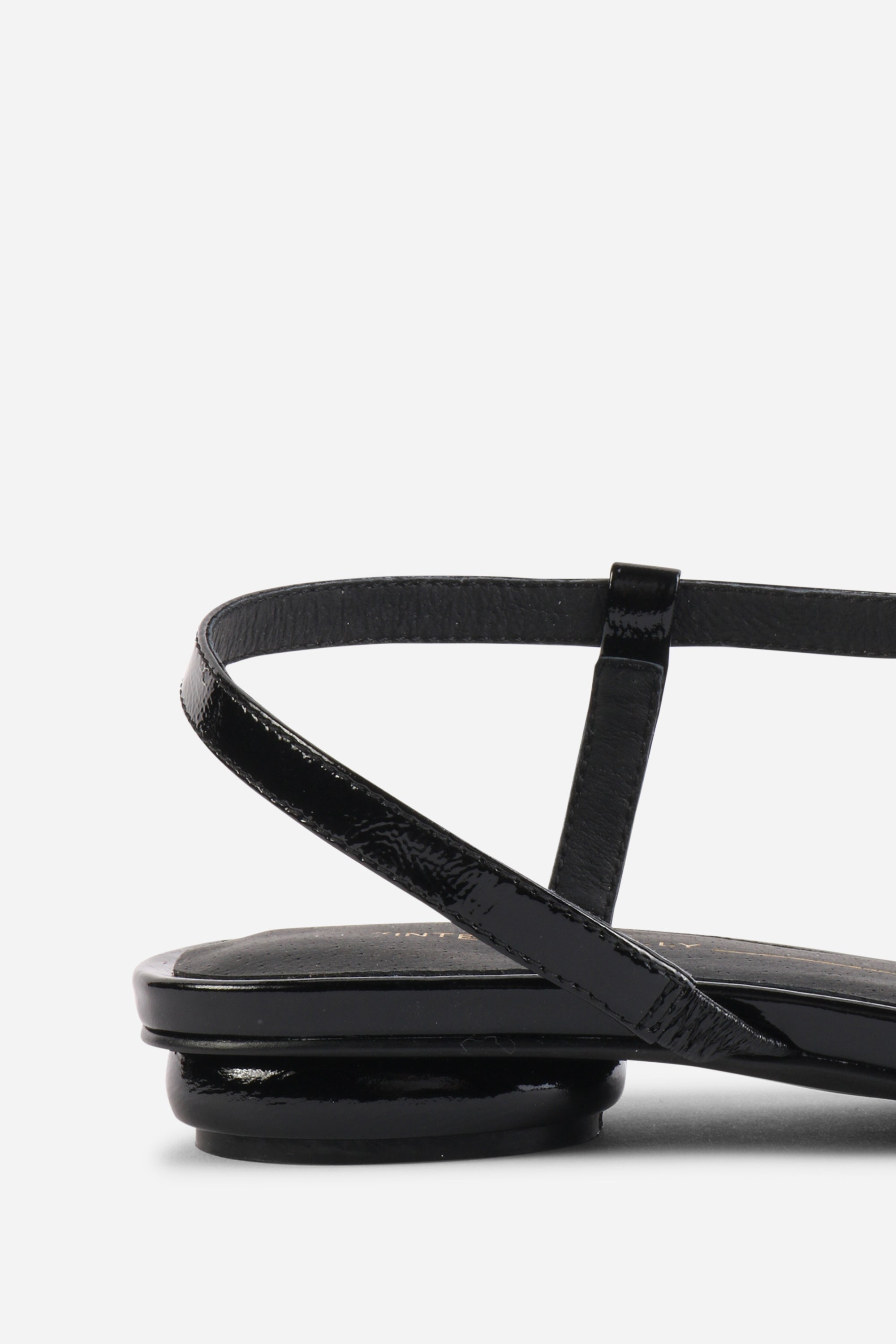 INTENTIONALLY __________. Nonfiction Flat Sandal