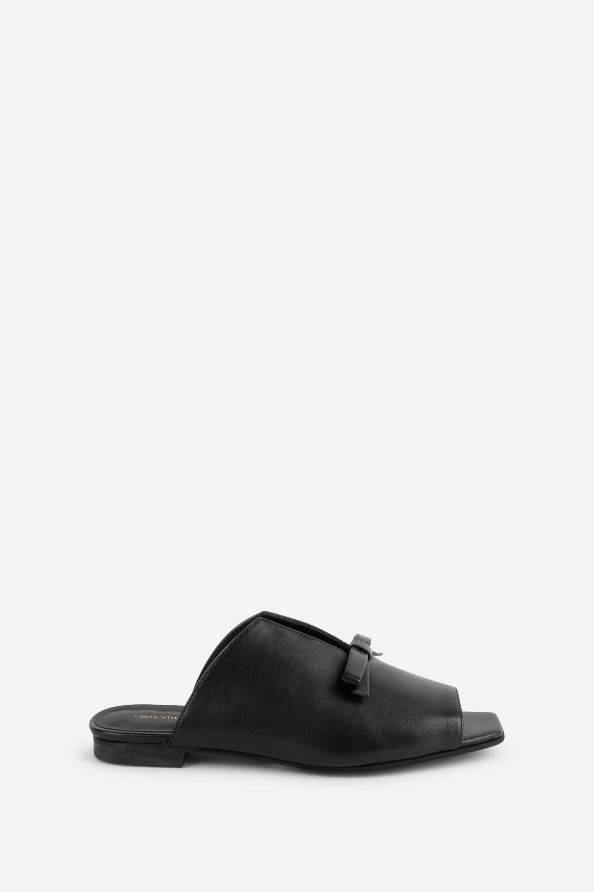 "INTENTIONALLY __________." Palace Square Toe Flat - Mercury