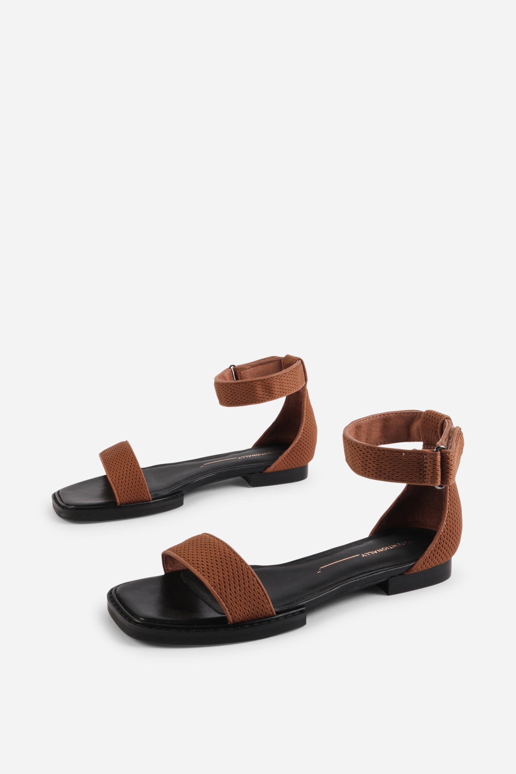 INTENTIONALLY __________. Potz Mesh Flat Sandal