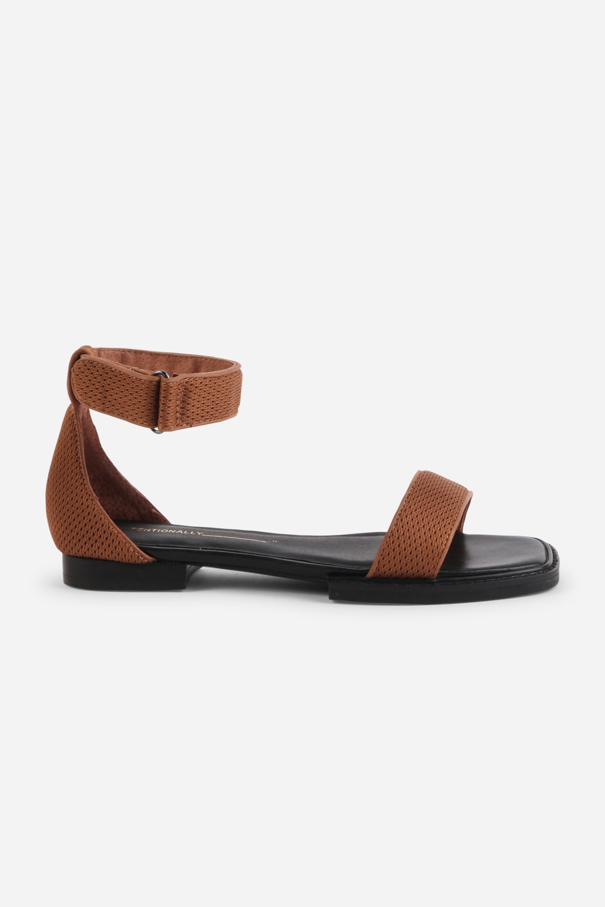 INTENTIONALLY __________. Potz Mesh Flat Sandal