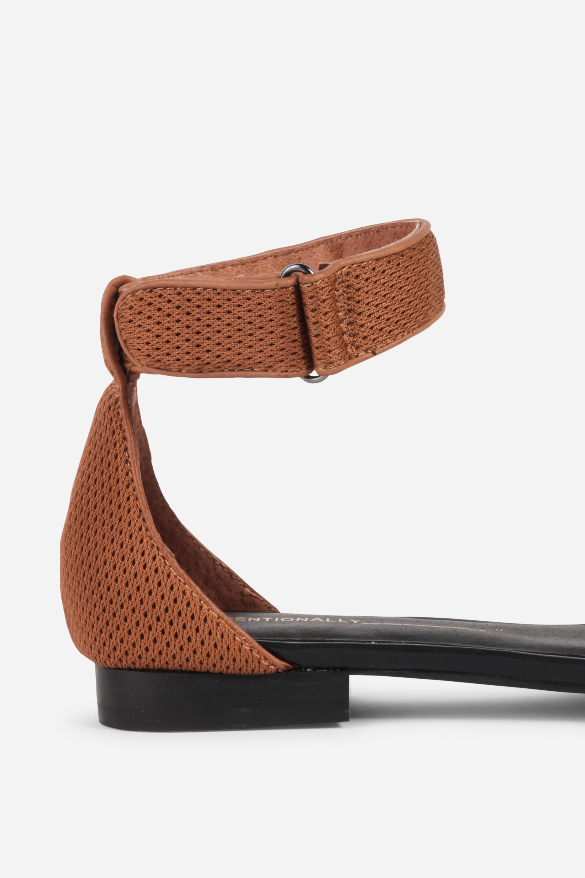 INTENTIONALLY __________. Potz Mesh Flat Sandal