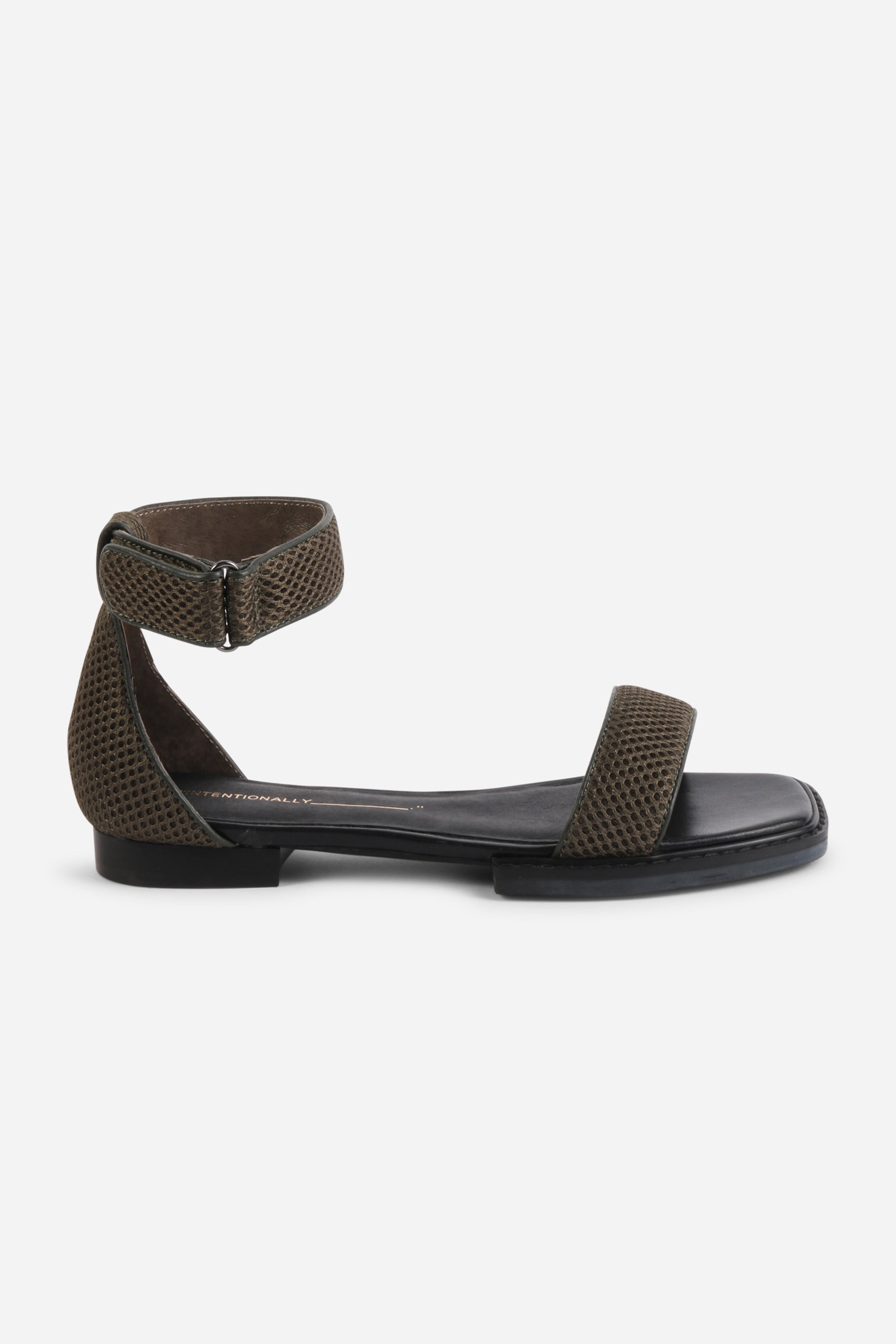INTENTIONALLY __________. Potz Mesh Flat Sandal