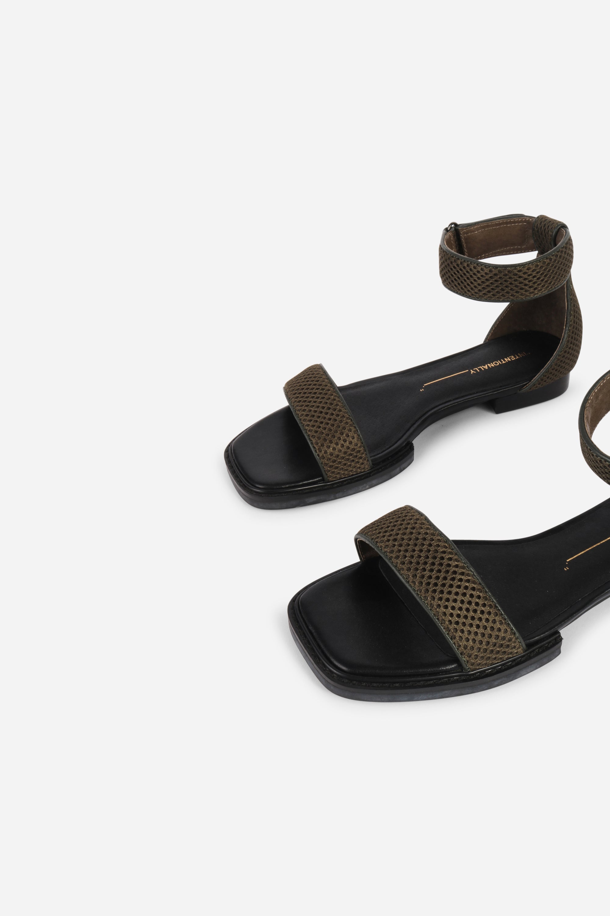INTENTIONALLY __________. Potz Mesh Flat Sandal