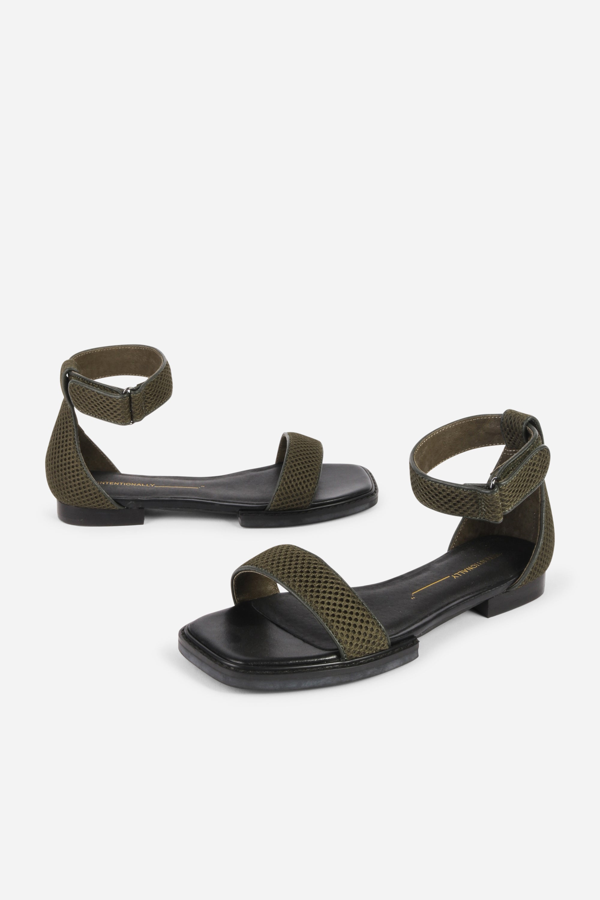 INTENTIONALLY __________. Potz Mesh Flat Sandal